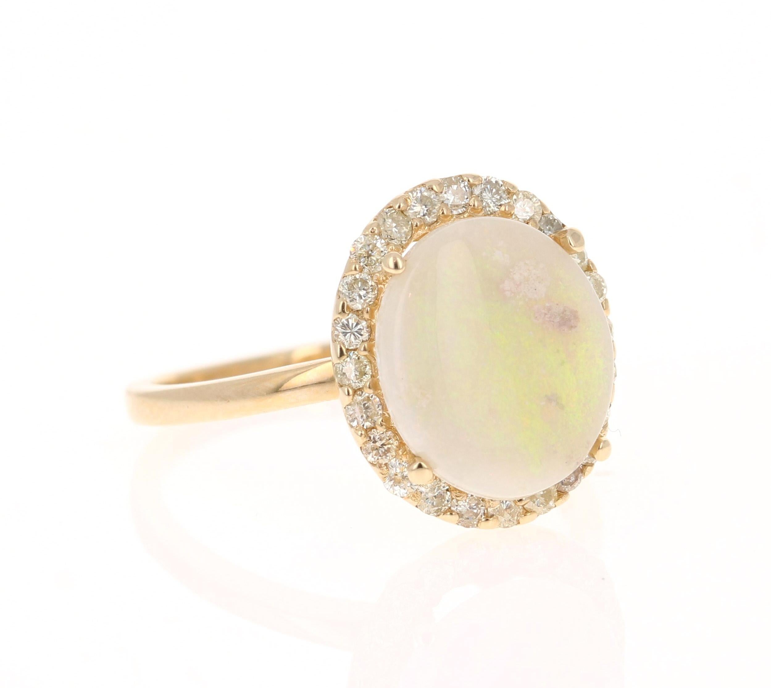 This ring has a cute and simple 2.11 Carat Opal and has 24 Round Cut Diamonds that weigh 0.42 Carats. The total carat weight of the ring is 2.53 Carats. 

The Opal measures at  12 mm x 10 mm (width x length) The Opal is white and has flashes of