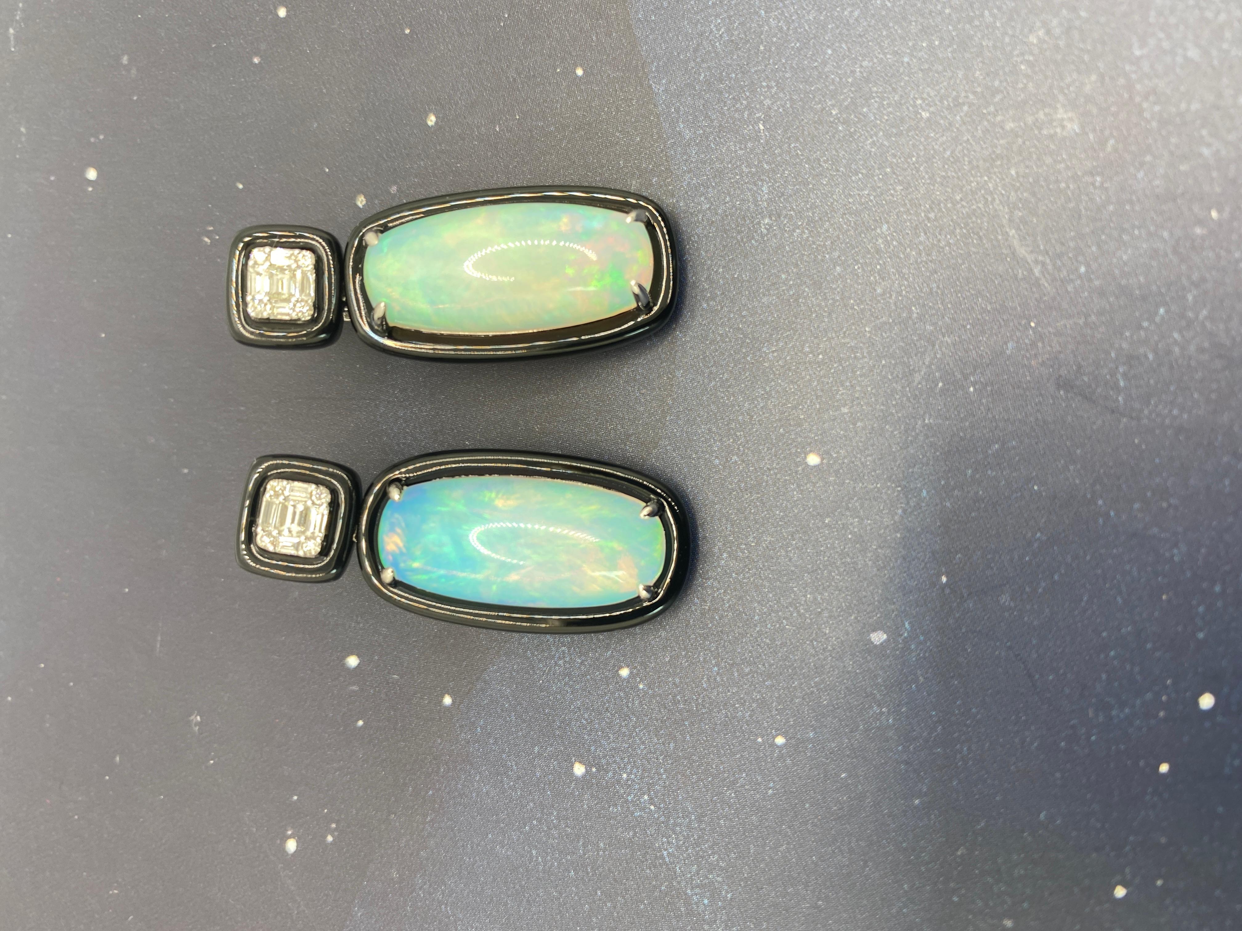 Significant opal earrings with spectacular flashes of light with 0.4 ctw in baguette and brilliant cut diamonds

Drop 35 mm