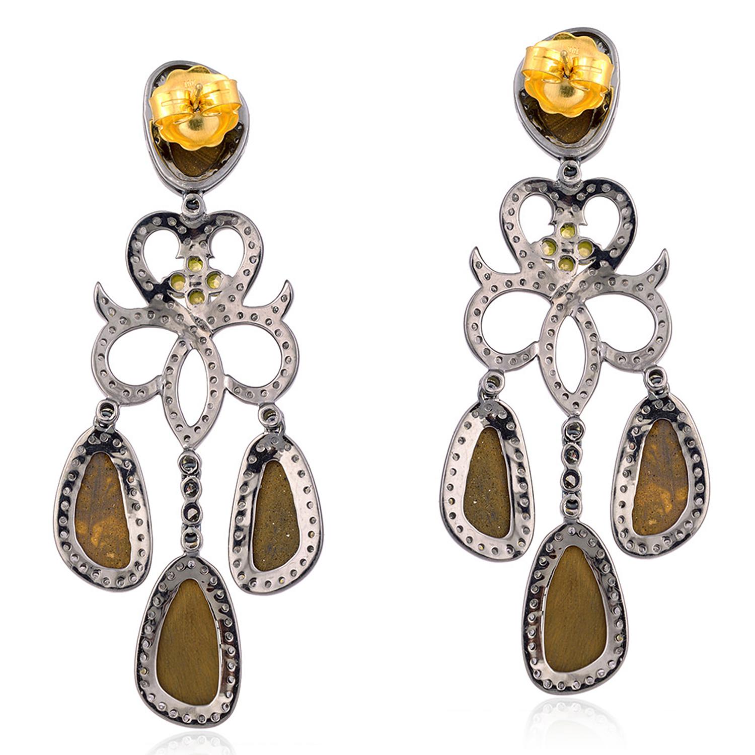 These stunning earrings are handmade in 18-karat gold and sterling silver.  
It is set with 14.4 carats opal doublets and 4.16 carats diamonds in blackened finish. 

FOLLOW  MEGHNA JEWELS storefront to view the latest collection & exclusive pieces. 