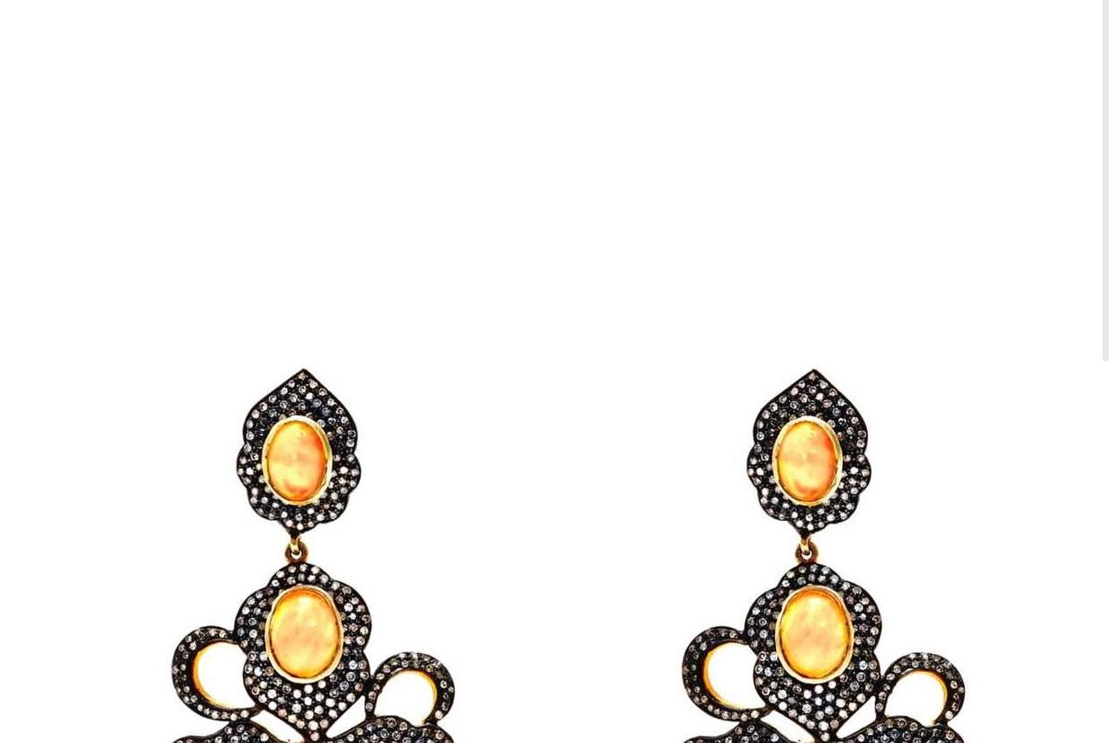 The Pink and Yellow iridescent luster of the Opals are beautifully highlighted with sparkling White Diamonds set in Gold and Blackened Oxidized Silver on the most fabulous chandelier earrings.

- Natural Pink and Yellow Opals.
- Natural White