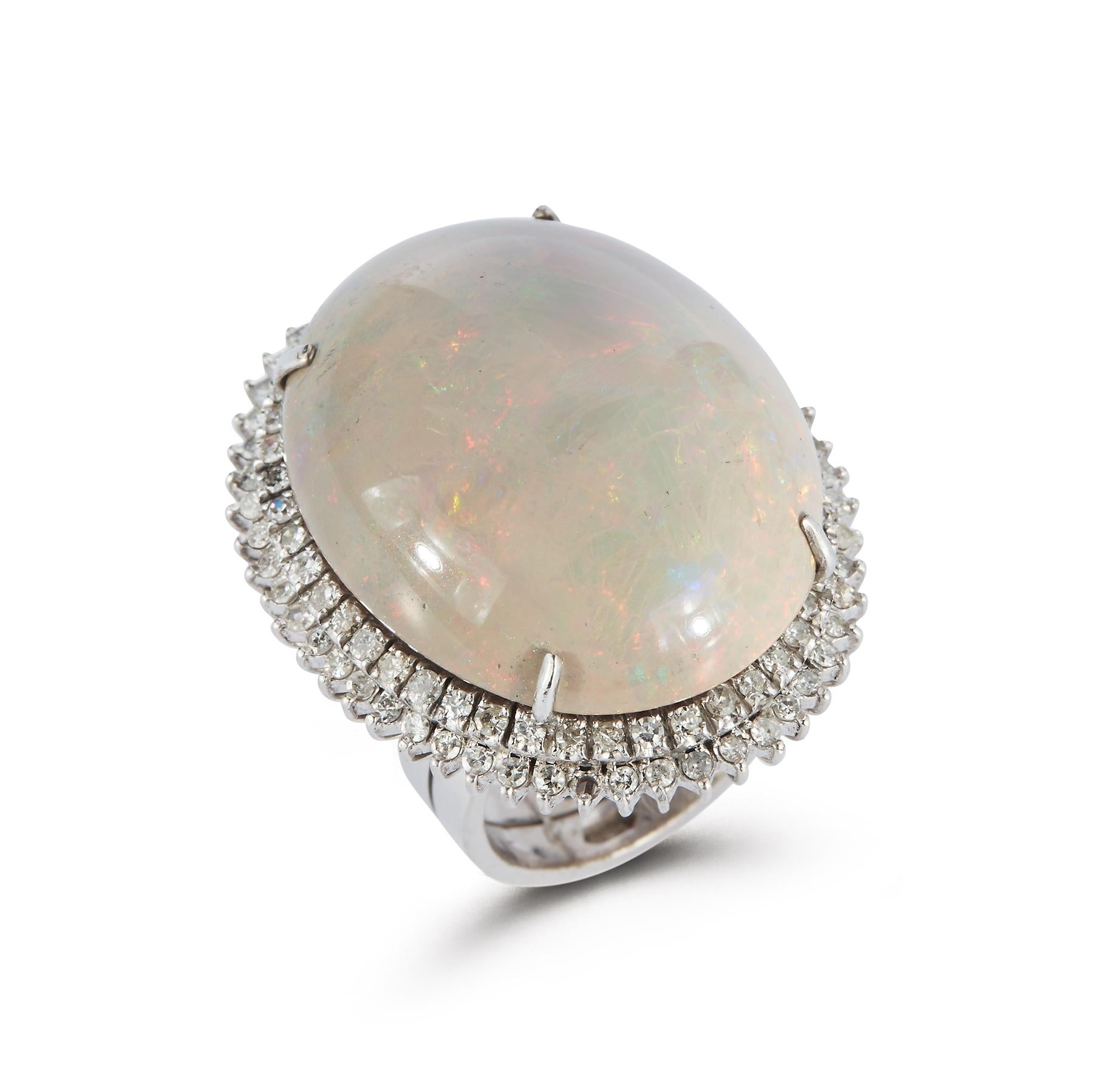 Opal & Diamond Cocktail Ring

Large Cabochon Opal Gem Surrounded by a 2 Row Round Cut Halo Diamonds

Ring Size: 6.25

Resizable Free of Charge

Gold Type: 14K White Gold