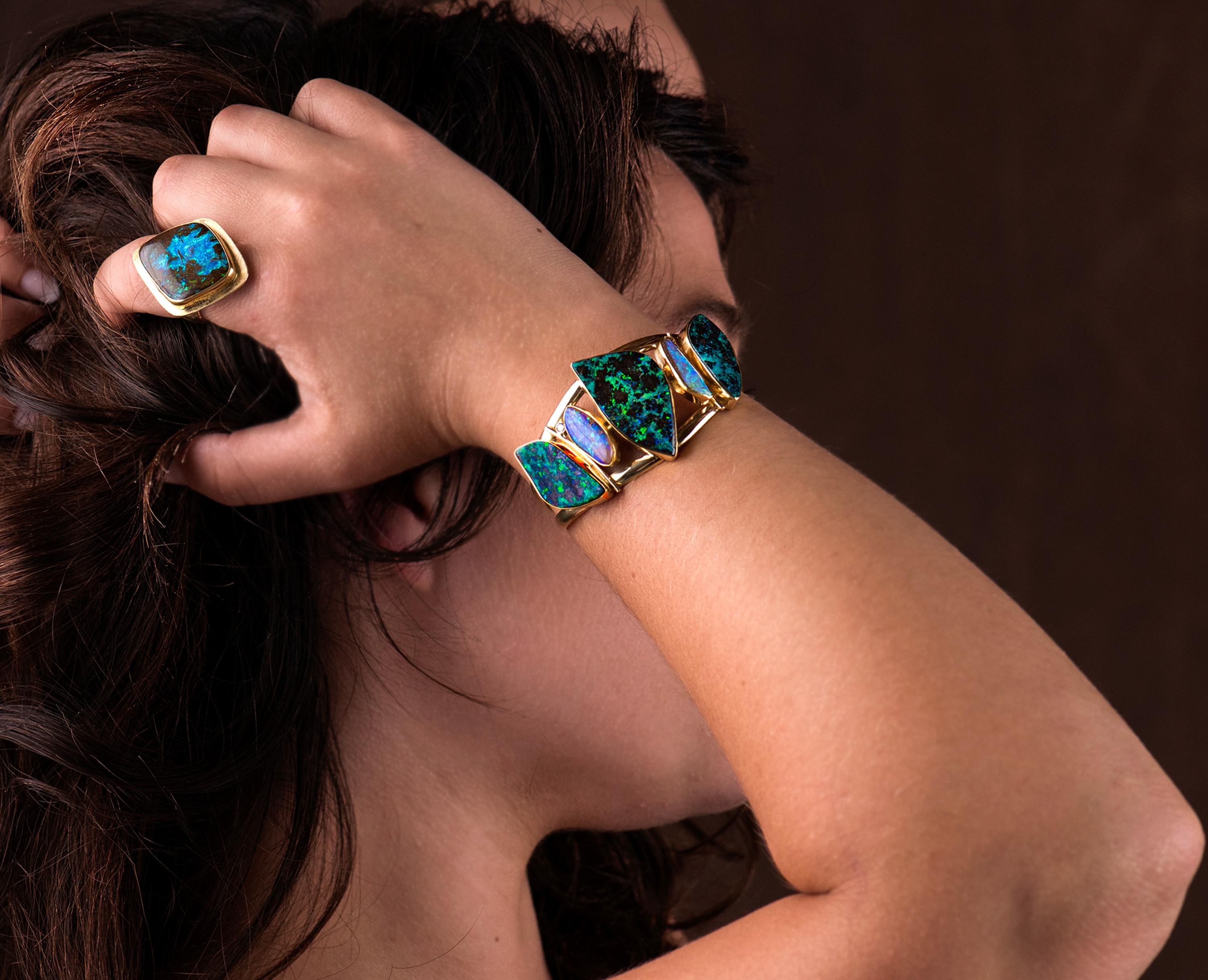What I love about Boulder Opal is not only the enormous variety in color, but also the pattern variety.  One can not help but feel like you are looking at abstract art on your arm, ears or neck.  The green/turquoise color in these boulder opals is