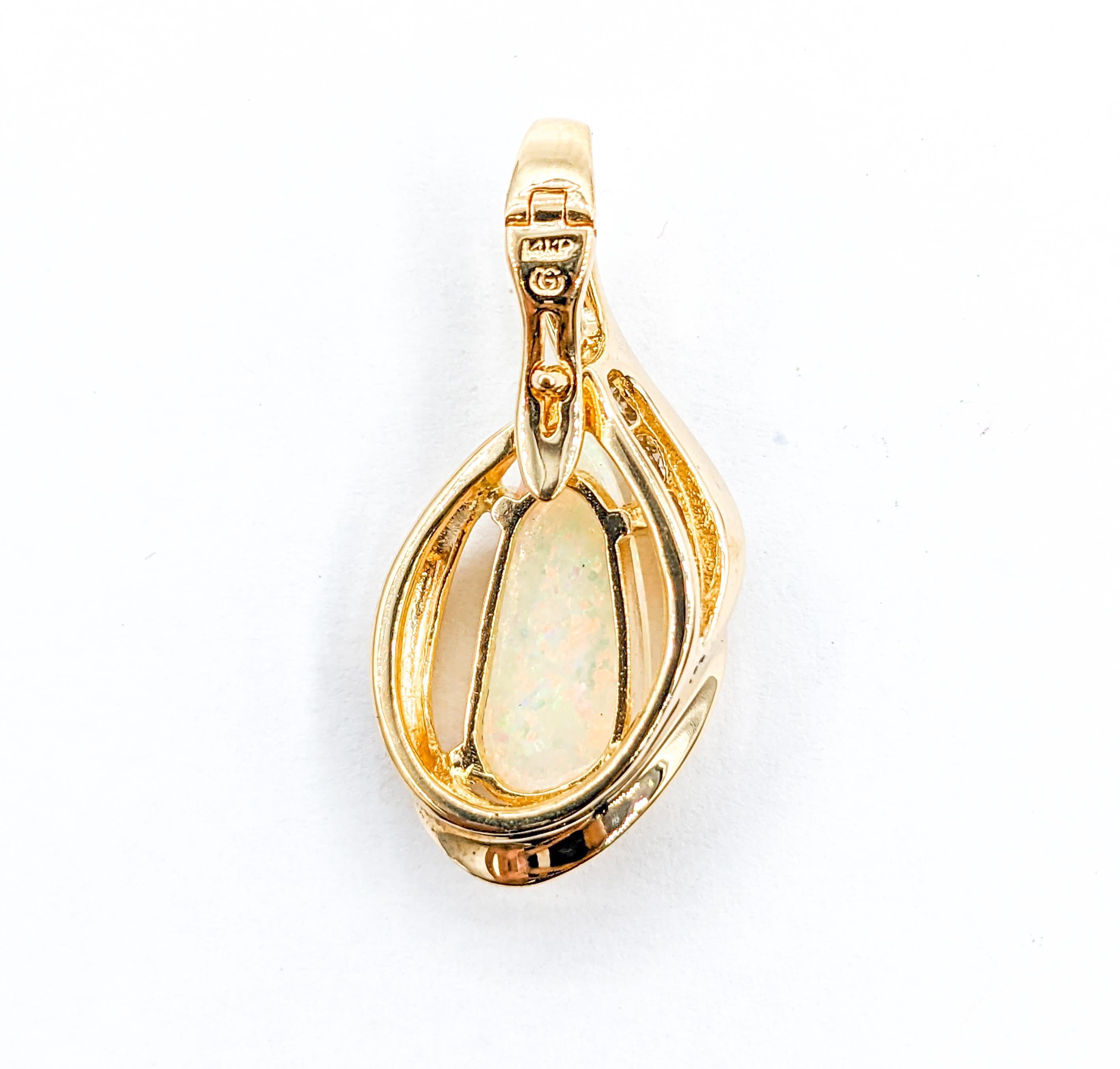 Opal & Diamond Enhancer Pendant Yellow Gold

Presenting an exquisite Pendant, skillfully crafted in 14kt yellow gold. It boasts an enhancer of .25ctw diamonds, each shimmering with SI clarity and a near-colorless brilliance. Complementing this