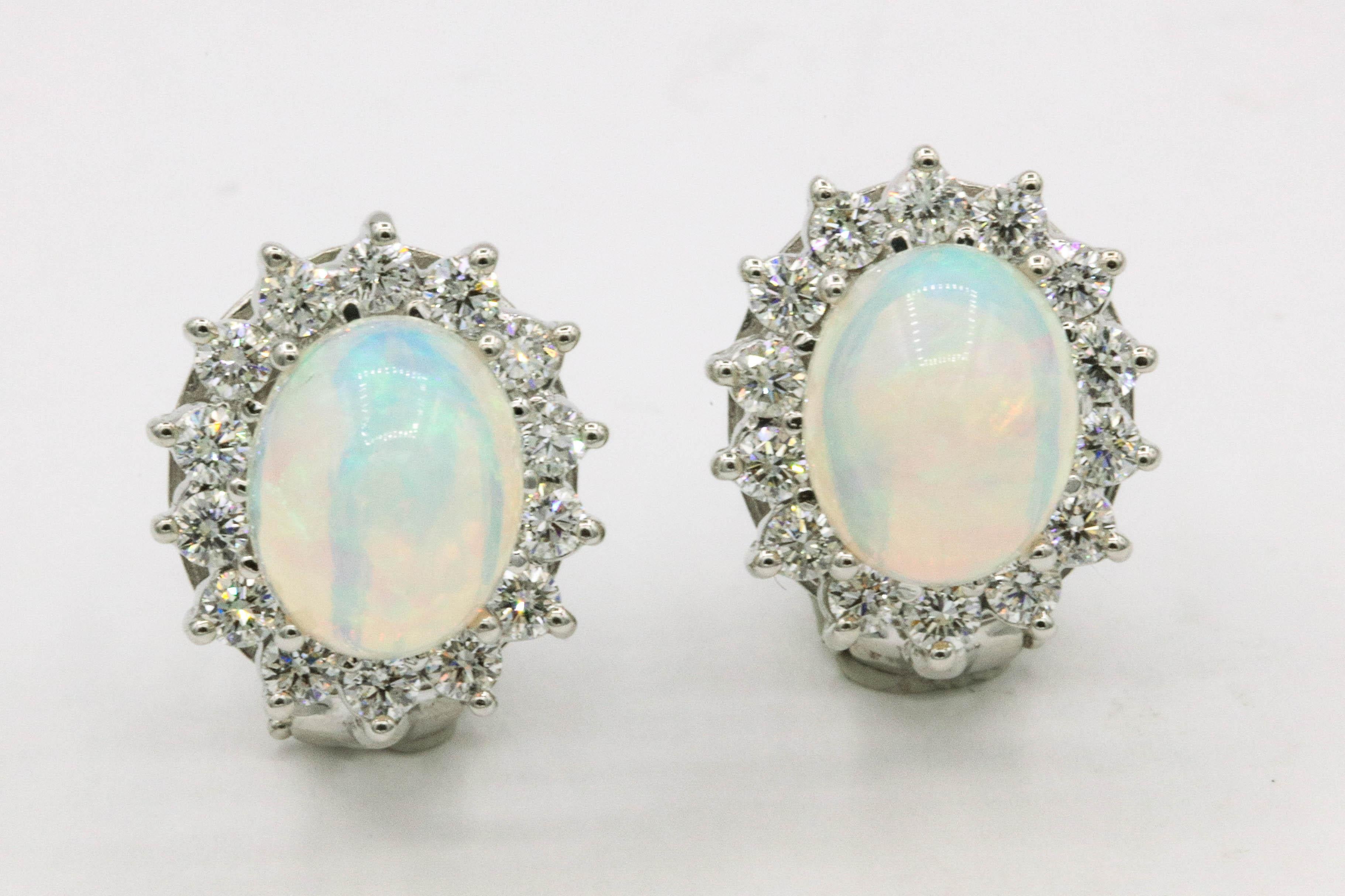 Ethiopian opal earring, 3.72 carats, flanked with a diamond floral halo weighing 1.24 carats, in 14k white gold.
Color G-H
Clarity SI