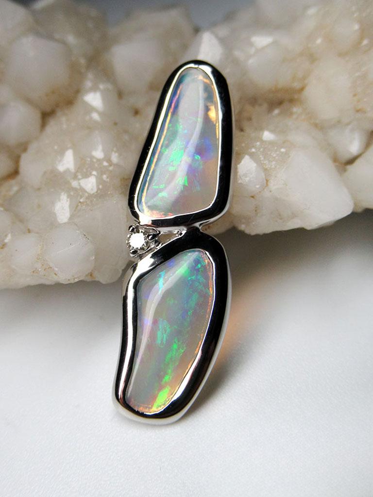 18K white gold pendant with natural opal and diamond
opal origin - Australia 
opal measurements - 0.039 x 0.2 x 0.43 in / 1 x 5 x 11 mm
stone weight - 1.10 carats
diamond weight - 0.2 carats
pendant length - 1.06 in / 27 mm
pendant weight - 1.97