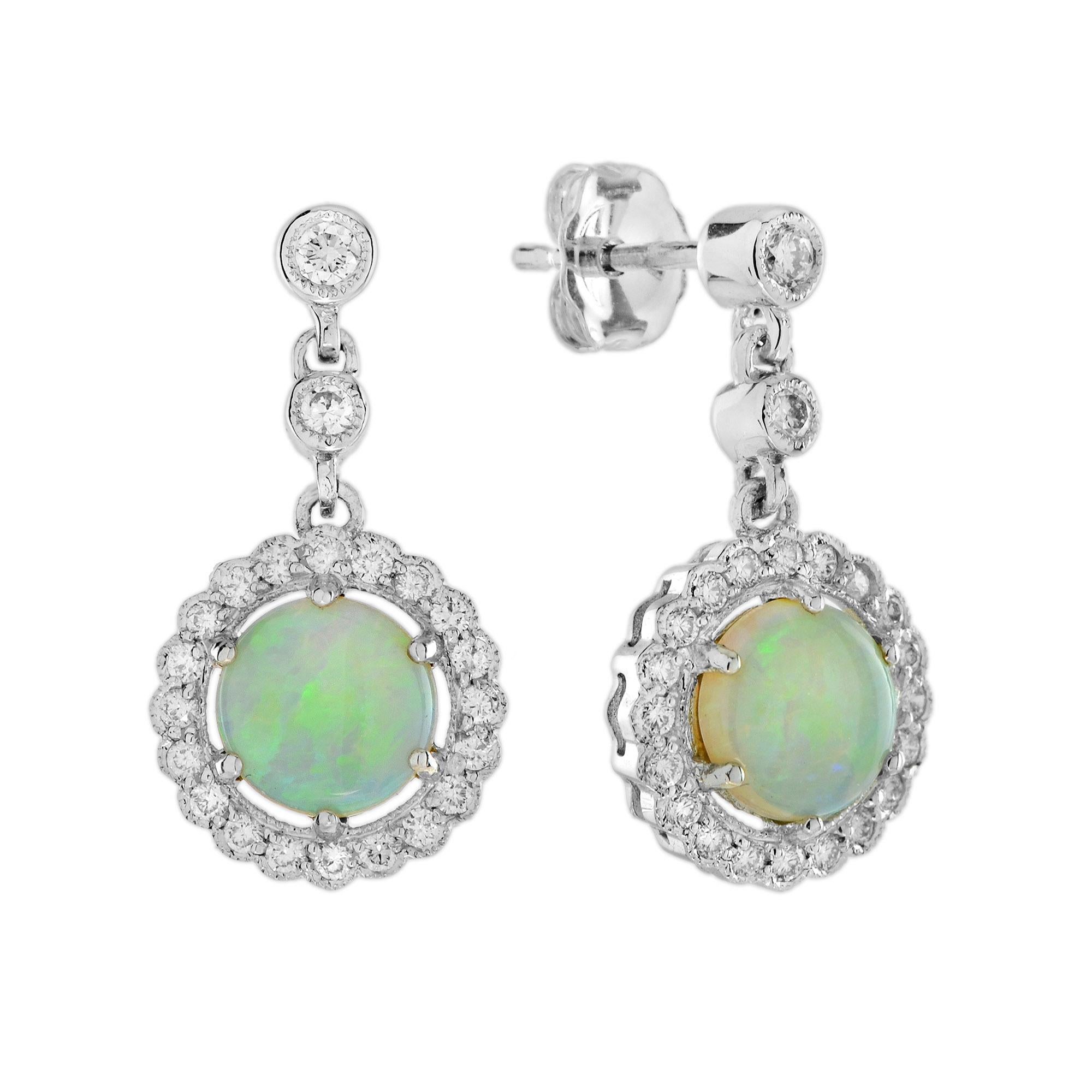 Immerse yourself in vintage glamour with this mesmerizing jewelry set, featuring a delicate floral pendant and matching earrings crafted in 14K white gold. At the heart of each piece lies a captivating opal, encircled by a halo of sparkling