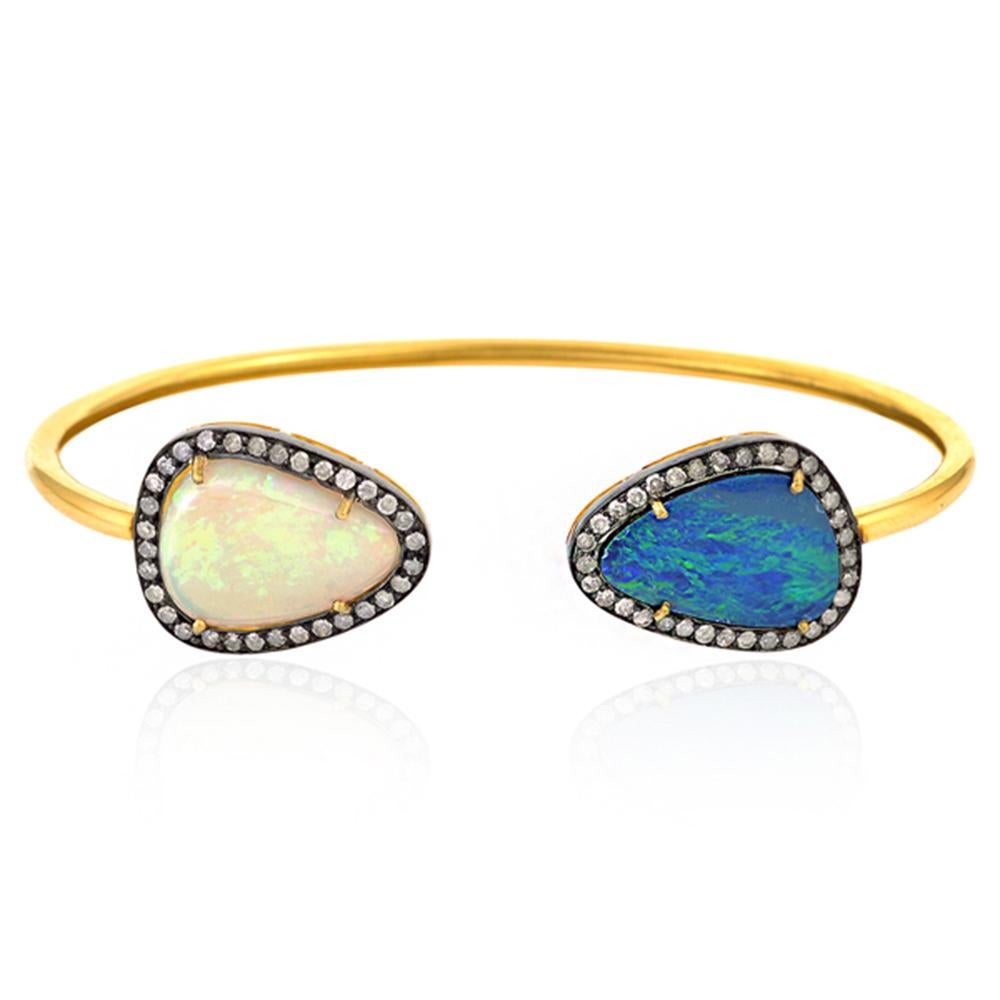 A beautiful bangle bracelet handmade in 18K & sterling silver. It is set in 7.9 carats opal and .72 carats of sparkling diamonds. 

FOLLOW  MEGHNA JEWELS storefront to view the latest collection & exclusive pieces.  Meghna Jewels is proudly rated as