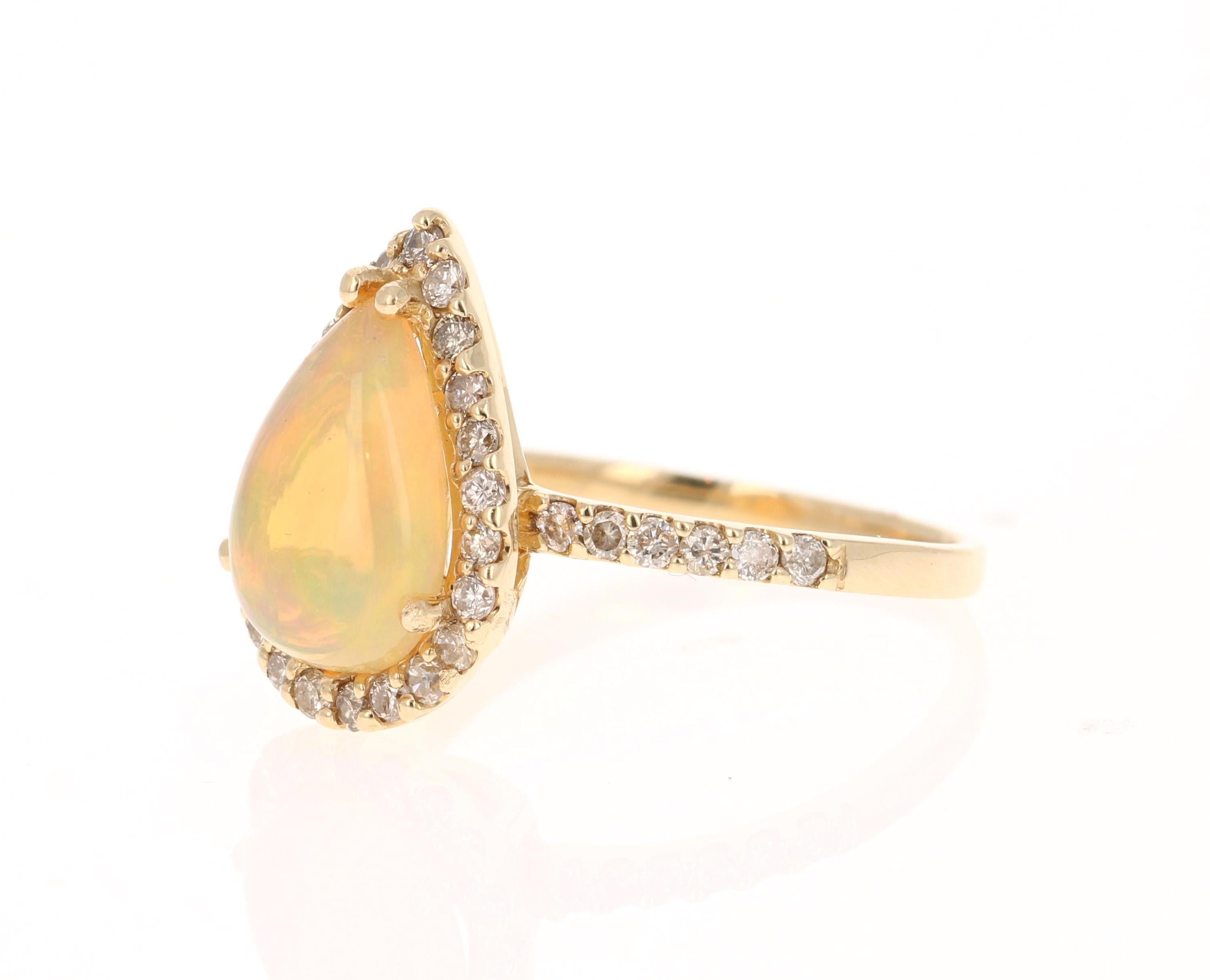 Contemporary Opal Diamond Pear Cut 14 Karat Yellow Gold Ring