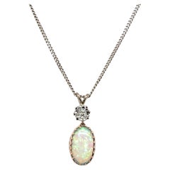 Opal & Diamond Pendant set in 18ct White & Rose Gold on 16" White Gold Chain