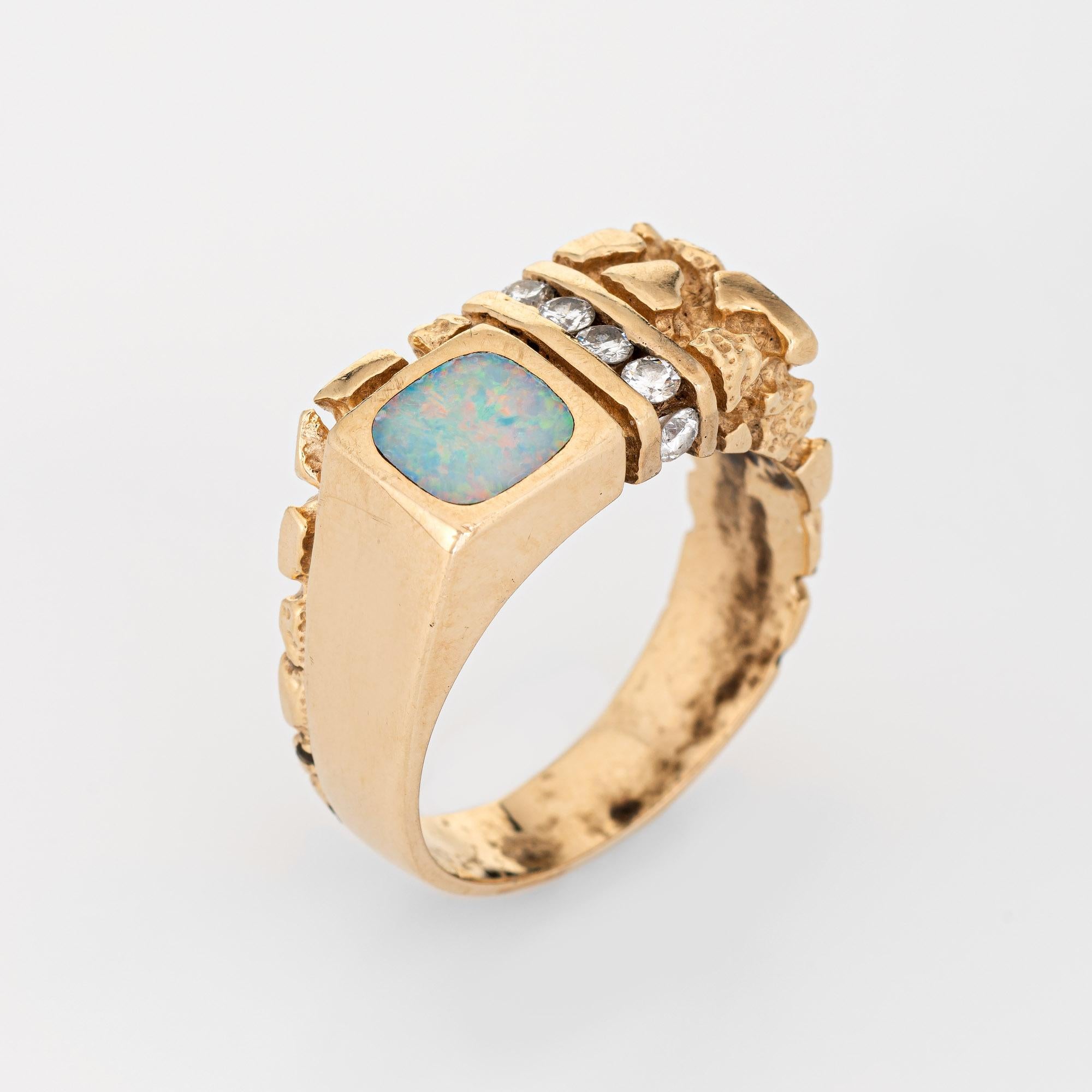 Stylish vintage opal & diamond nugget ring (circa 1970s) crafted in 14 karat yellow gold. 

Inlaid opal measures 7mm x 7mm, accented with six round brilliant cut diamonds totaling an estimated 0.30 carats (estimated at H-I color and SI1-I1 clarity).