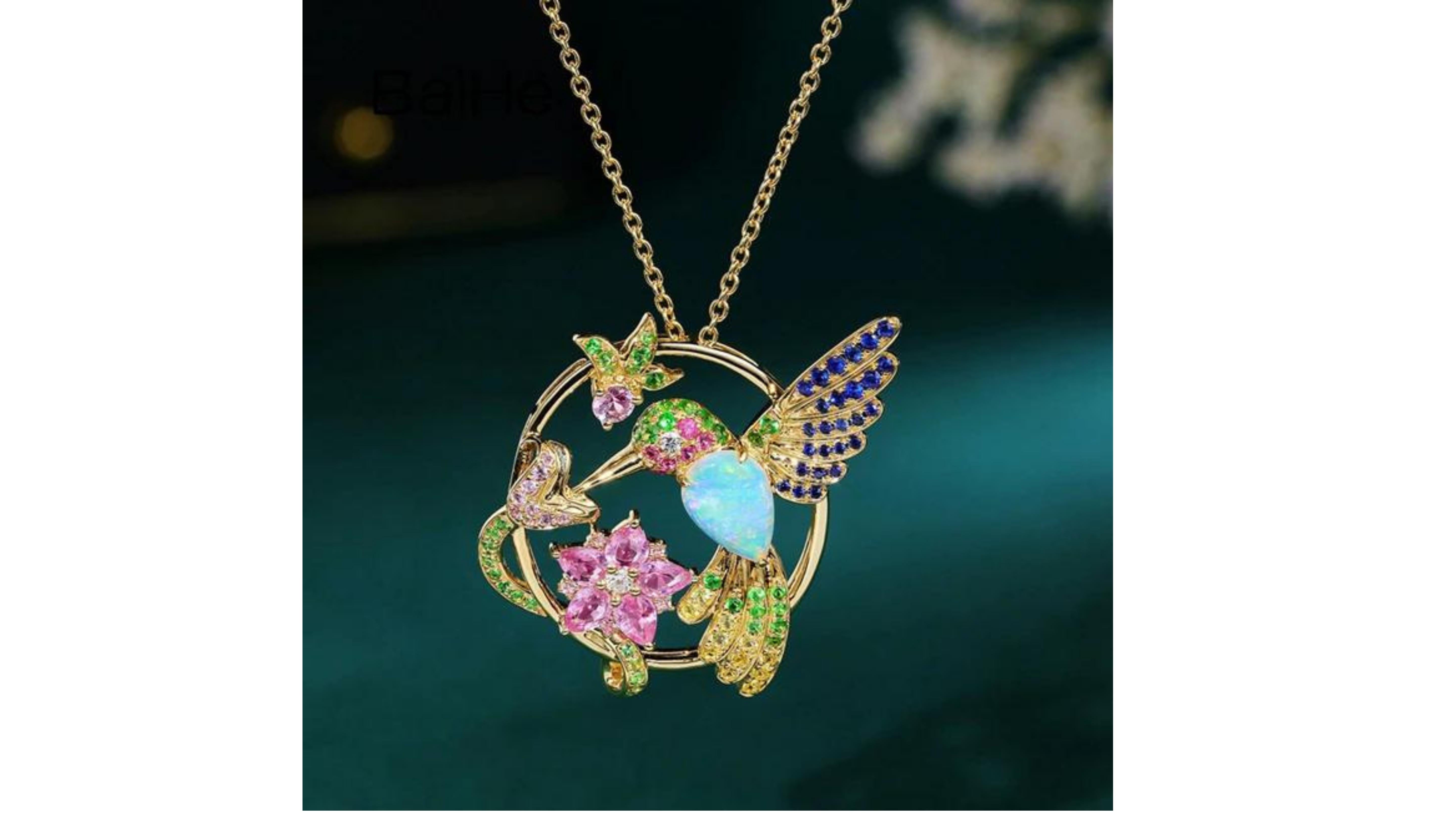 
Opal Diamond  Blue Sapphire Tsavorite Diamond Humming Bird Necklace 18 Karat  Yellow Gold  is very unique and has this tropical look with the Hummingbird on. It shows what can be made too if you are looking for anything specific or would like a