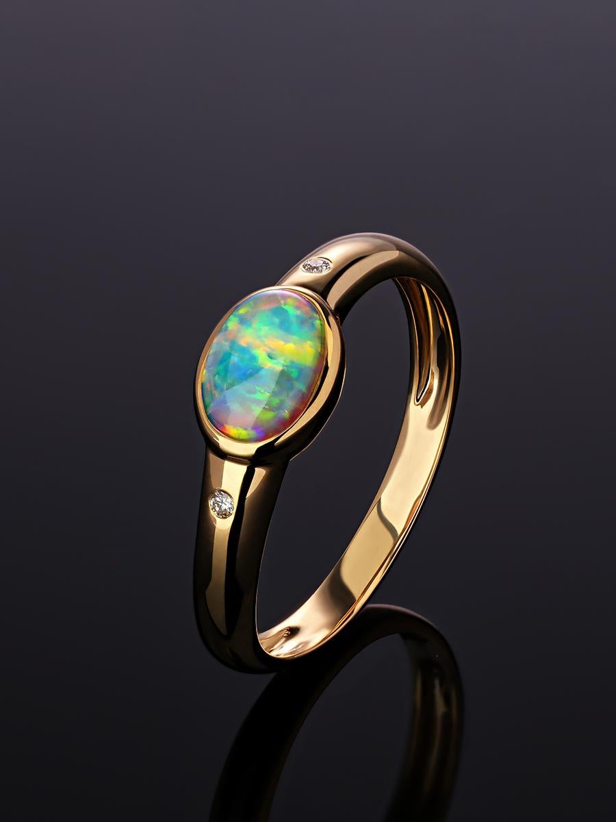 14K yellow gold ring with crystal Natural Opal and diamonds
opal origin - Australia 
opal measurements - 0,12 х 0.2 х 0,28 in / 3 х 5 х 7 mm
stone weight - 0,65 carat
ring weight - 1.80 grams
ring size - 6.5 US (we can resize) 

Minimal collection