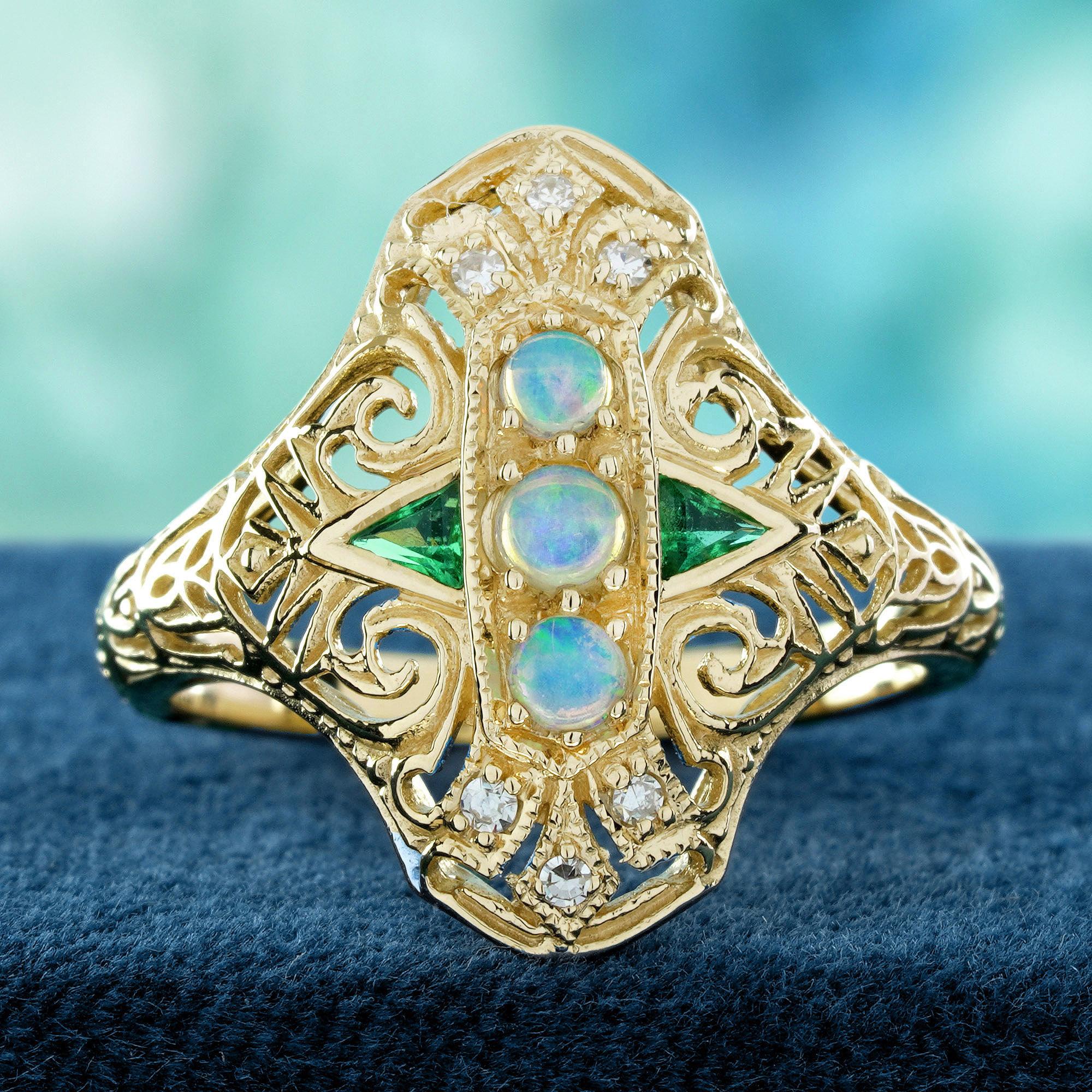 This vintage-style three-stone ring features three stunning natural opals at the center, flanked by triangular emeralds on each side. The design is enhanced with diamonds at each point, adding an extra touch of brilliance. The intricate detailing