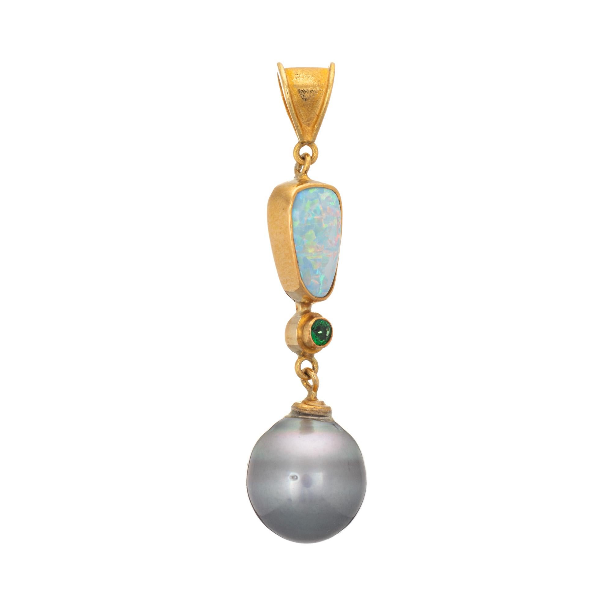 Finely detailed vintage opal, emerald & baroque pearl pendant crafted in high karat 22k yellow gold. 

The opal measures 10mm x 6mm, accented with an estimated 0.05 carat emerald. The grey baroque pearl measures 11mm. The opal is in excellent