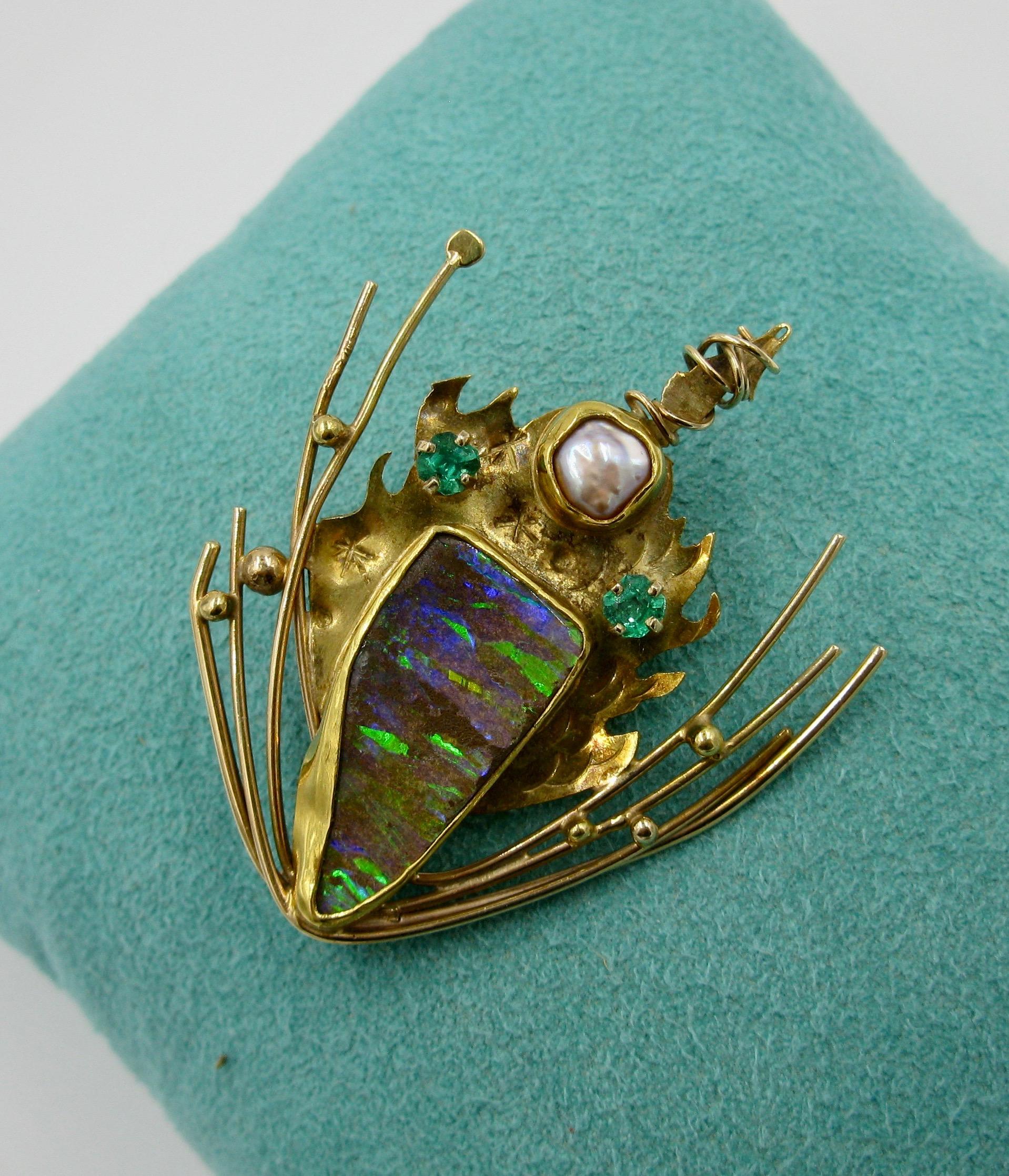 A spectacular Mid-Century Modern Opal Emerald Pearl Brooch by Daniel Spirer of Massachusetts in 22, 18 and 14 Karat Gold, titled 