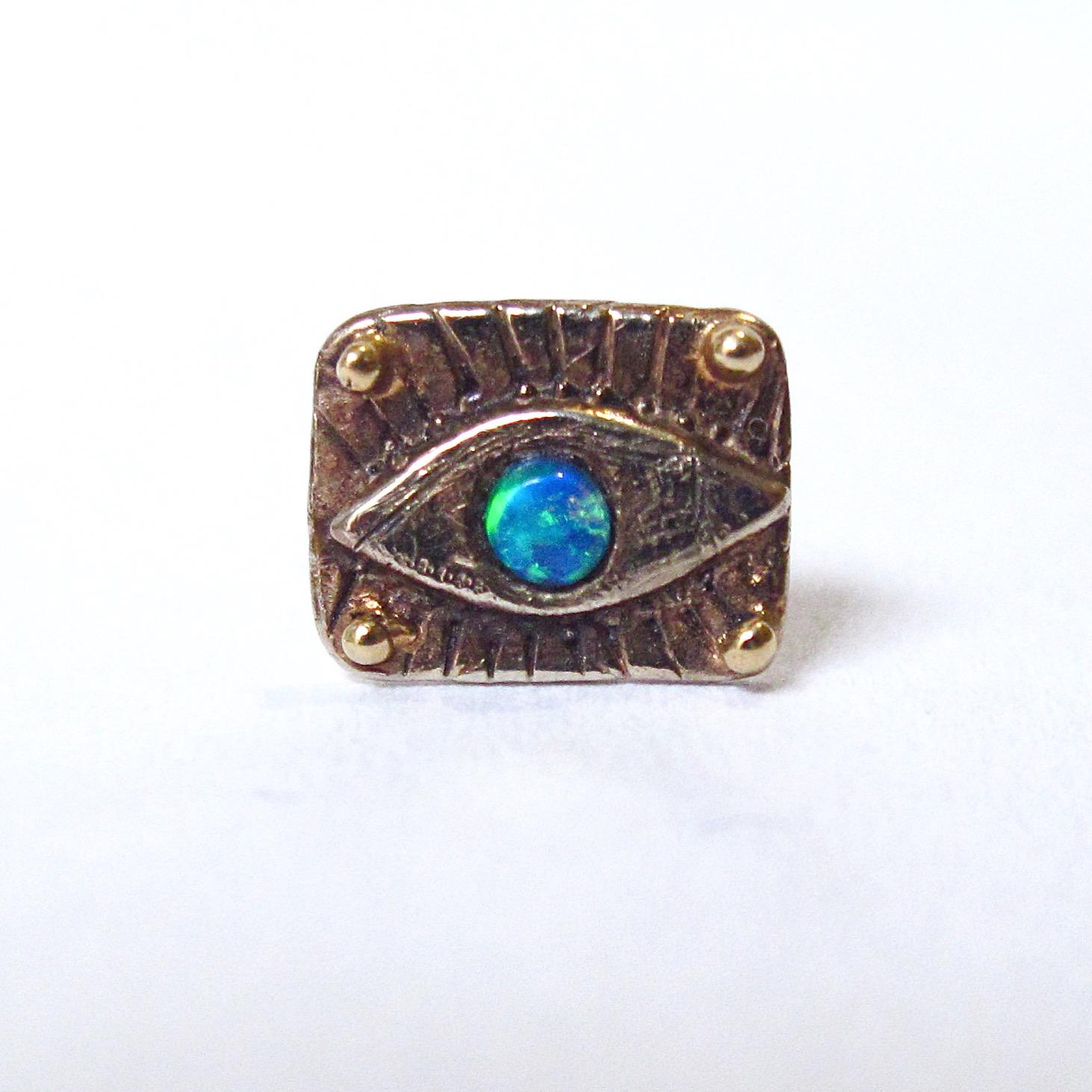 18k white gold evil eye stud earring with dynamic opal cabochon and 22k gold granulated bead adornments. 