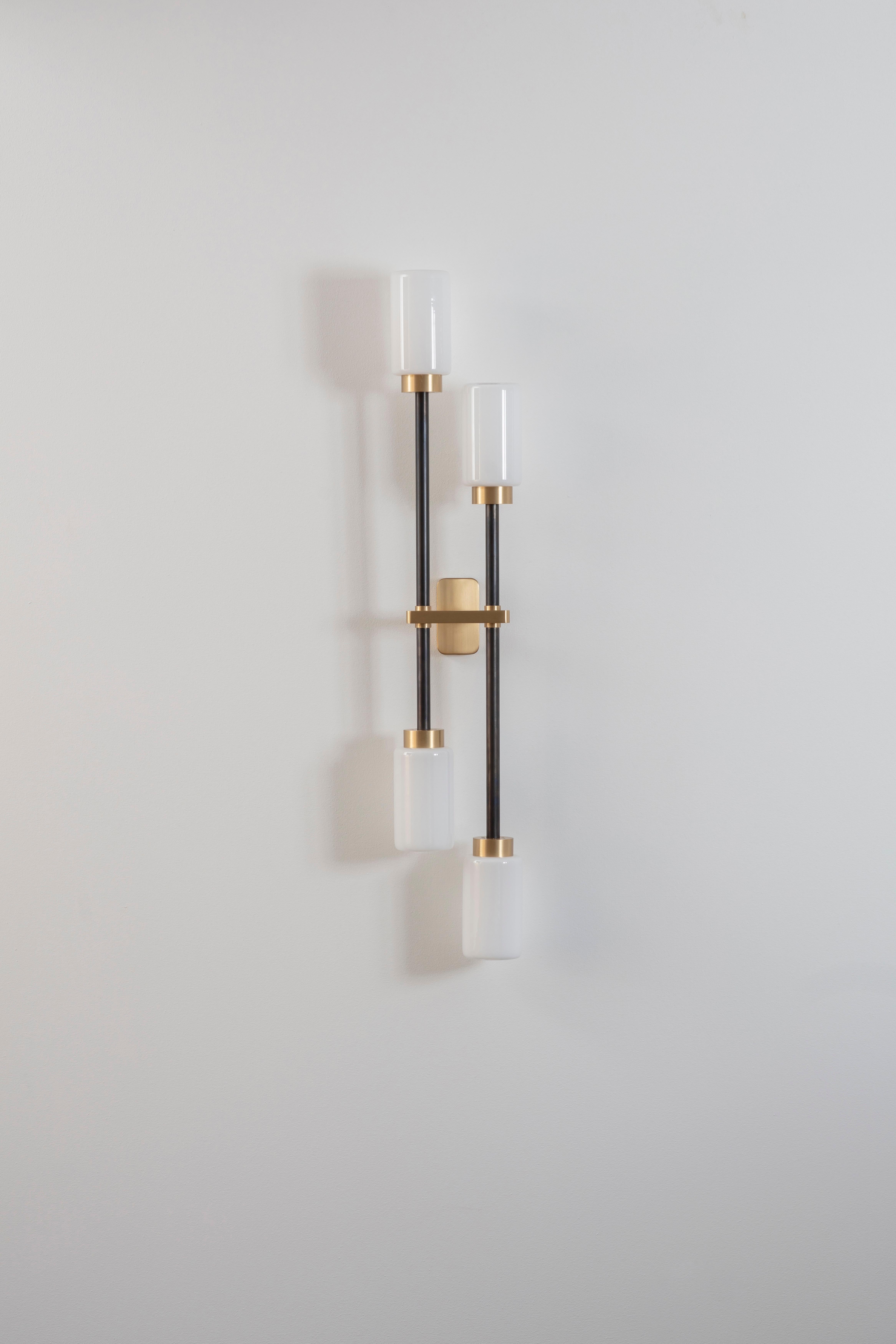 Opal Farol double wall light by Bert Frank
Dimensions: H 79 x W 15 x D 7 cm
Materials: Brass, bronze and opal

Available finishes: Bronzed brass, black brass
All our lamps can be wired according to each country. If sold to the USA it will be