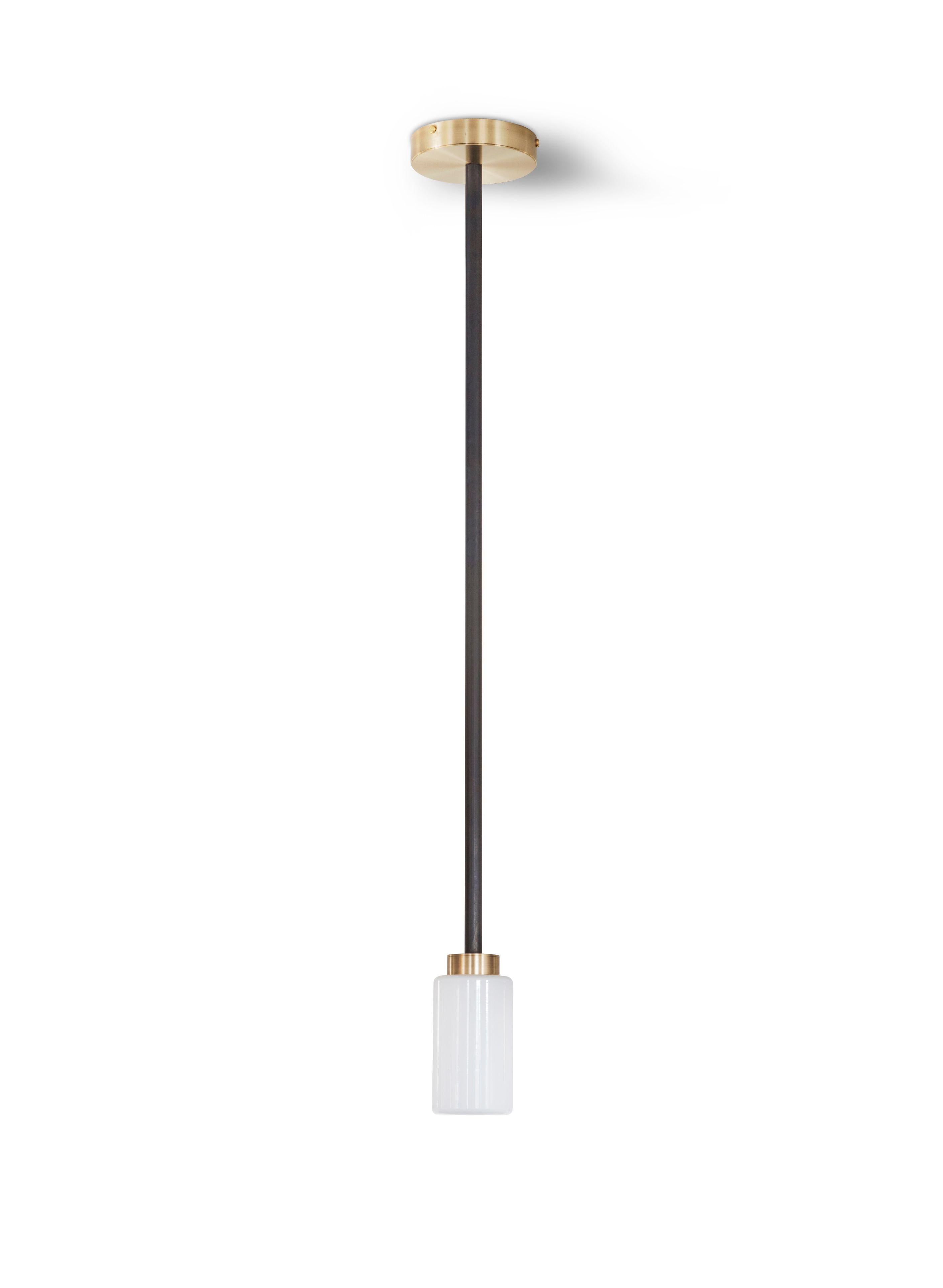 Opal Farol pendant by Bert Frank
Dimensions: H 14 x D 7 cm
Materials: Brass, bronze and opal

Available finishes: Bronzed brass and black brass
All our lamps can be wired according to each country. If sold to the USA it will be wired for the USA for