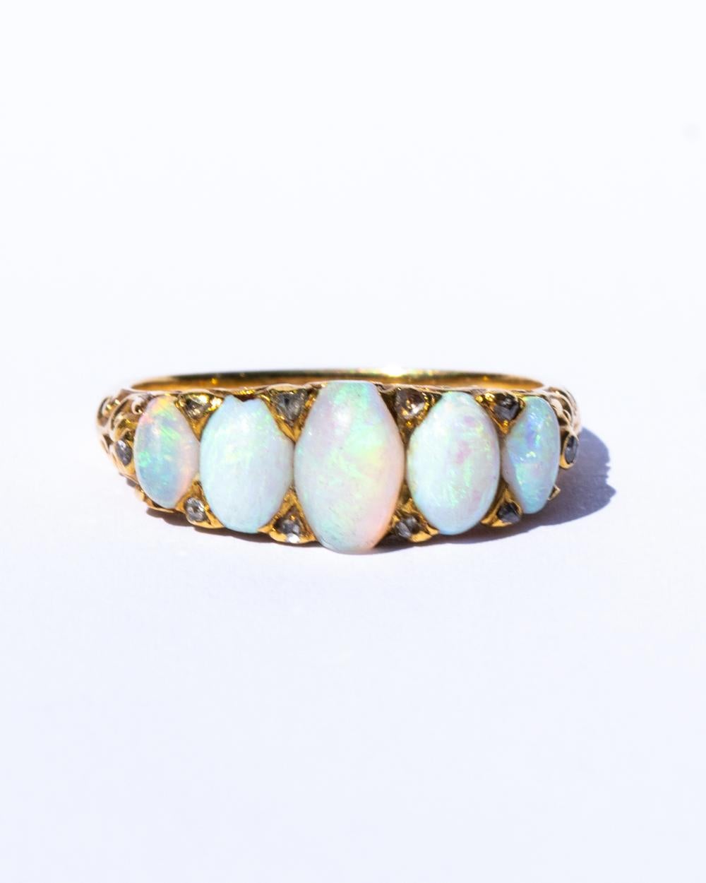 Chunky opal five stone with diamond points in 18ct yellow gold. Size Uk O.