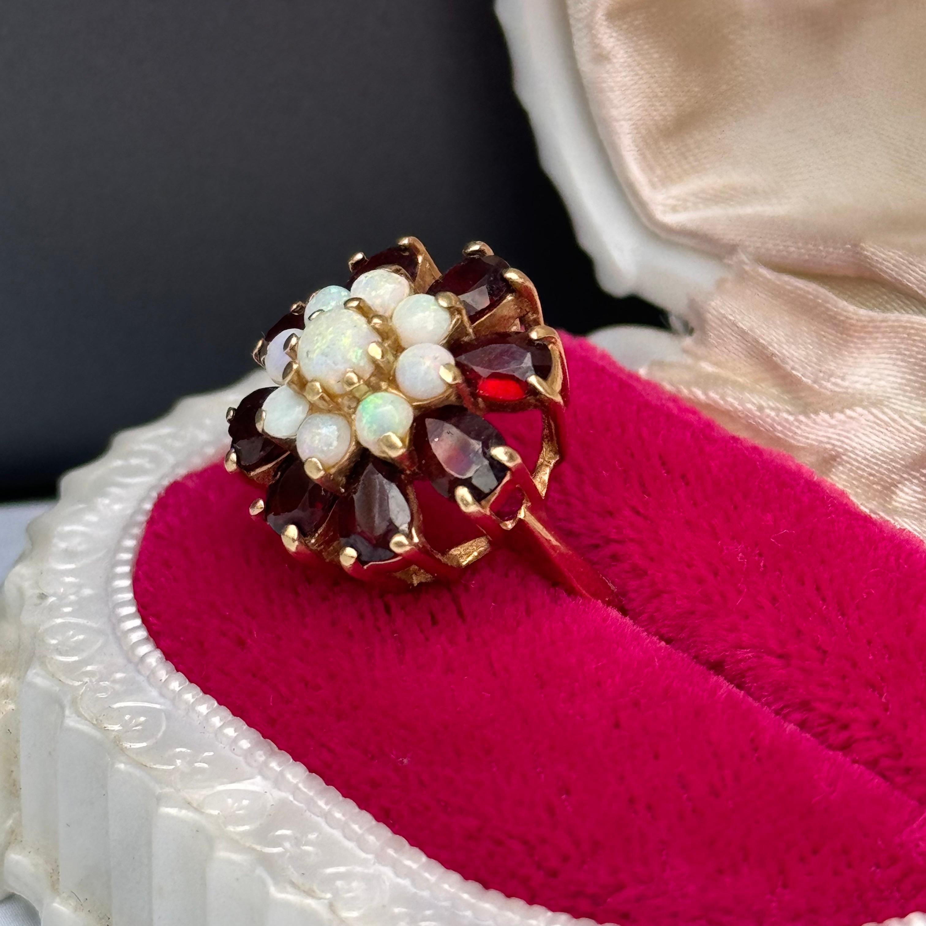 Vintage  Victorian Revival Opal Garnet Cluster Cocktail Ring in 14kt Gold, a stunning homage to the elegance of the Victorian era. This exquisite ring features a cluster of opals and garnets set in luxurious 14kt gold, evoking the opulence and