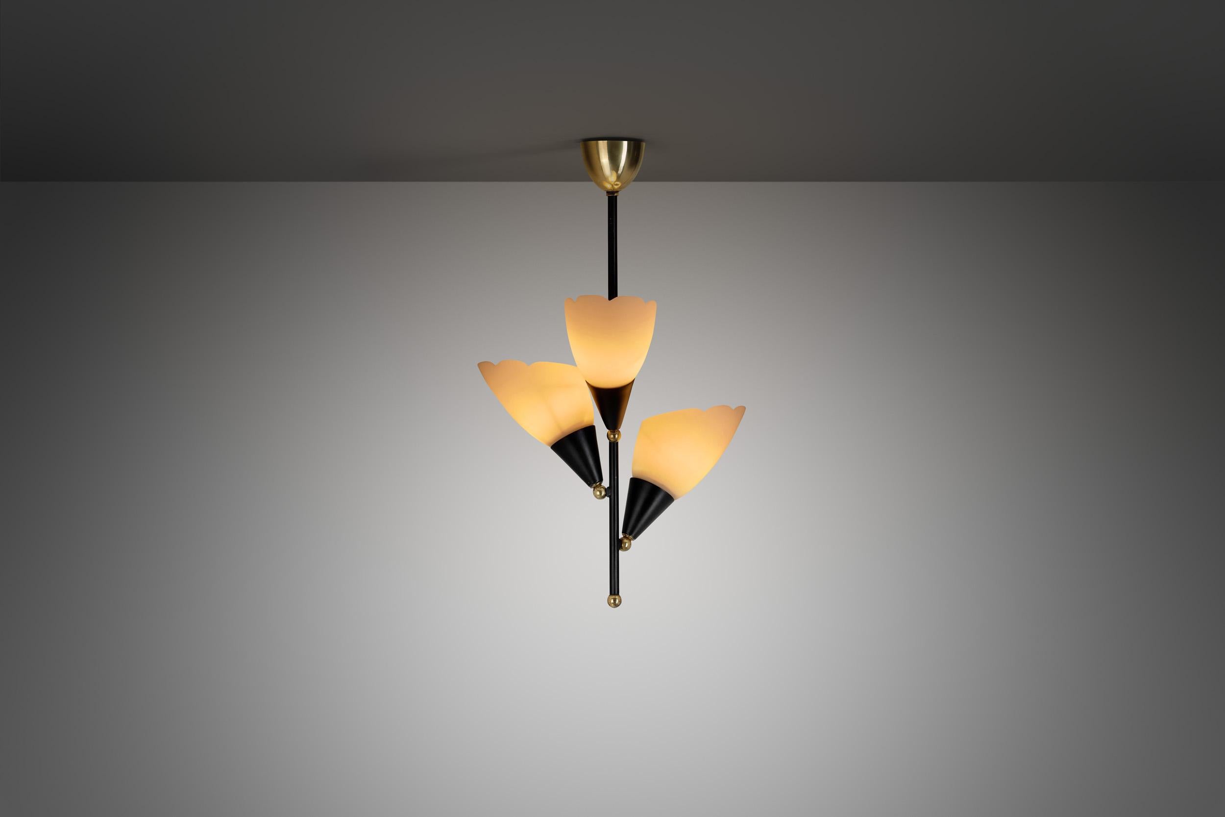 This chandelier is full of personality, with unexpected details that make it unique. The mid-century modern design era was known for sleek lines with organic shapes, using new materials and methods to re-imagine traditional pieces, as this piece