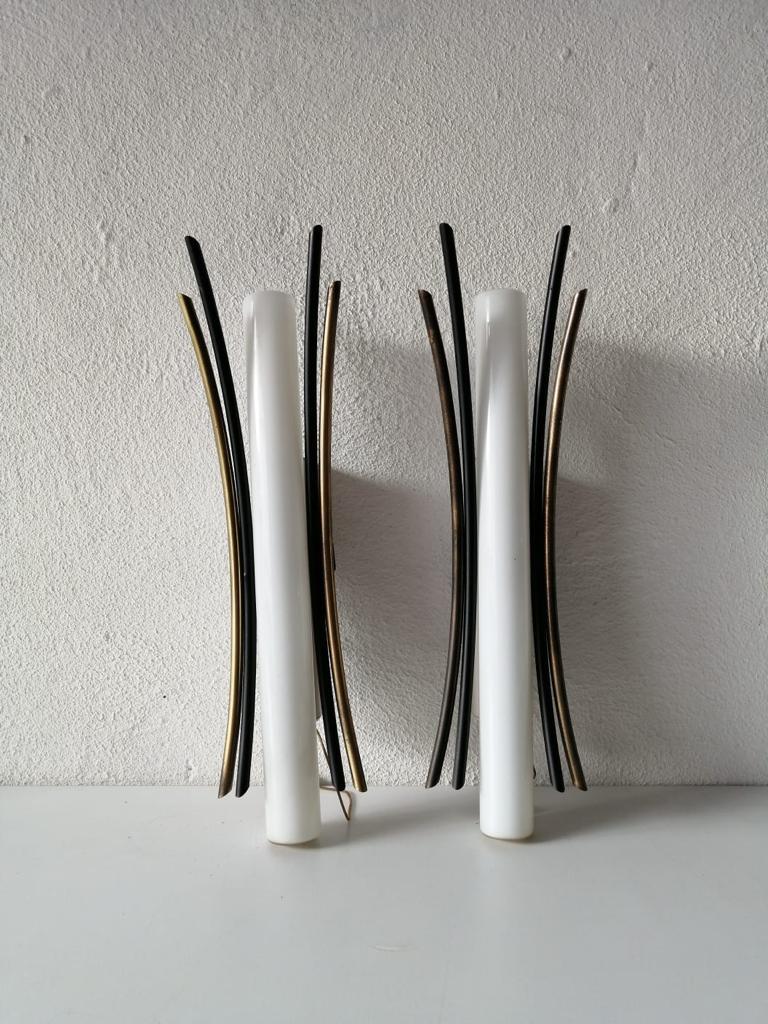 Opal glass tubes & gold and black metal arc shaped sticks pair of sconces by Brendel - Loewig Berlin, 1950s, Germany

Stilnovo Era elegant high quality wall lamps.

Lamps are in very good vintage condition.
Wear consistent with age and
