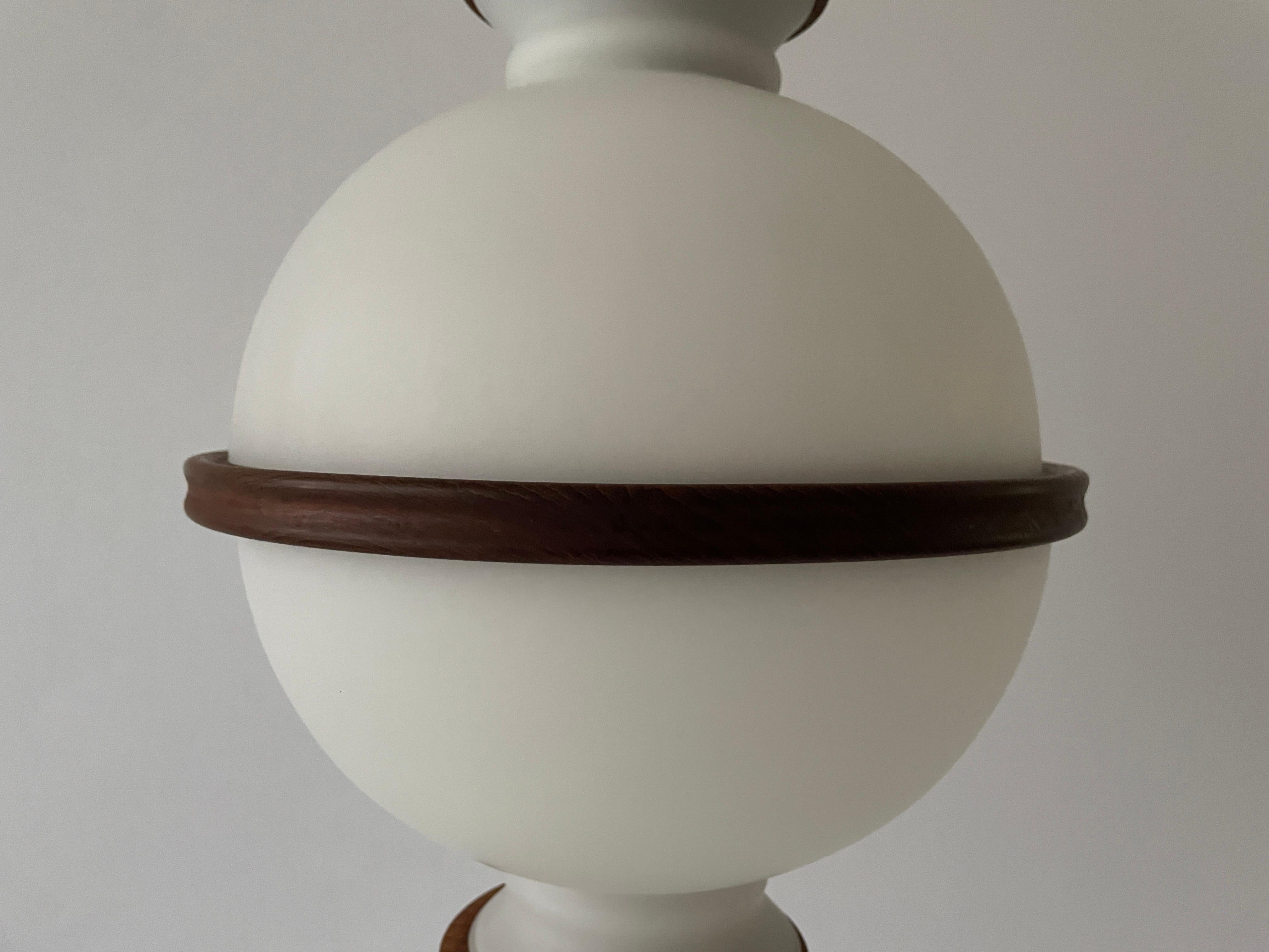 Opal Glass and Teak Ceiling Lamp by Reggiani Illuminazione, 1960s, Ital In Good Condition For Sale In Hagenbach, DE