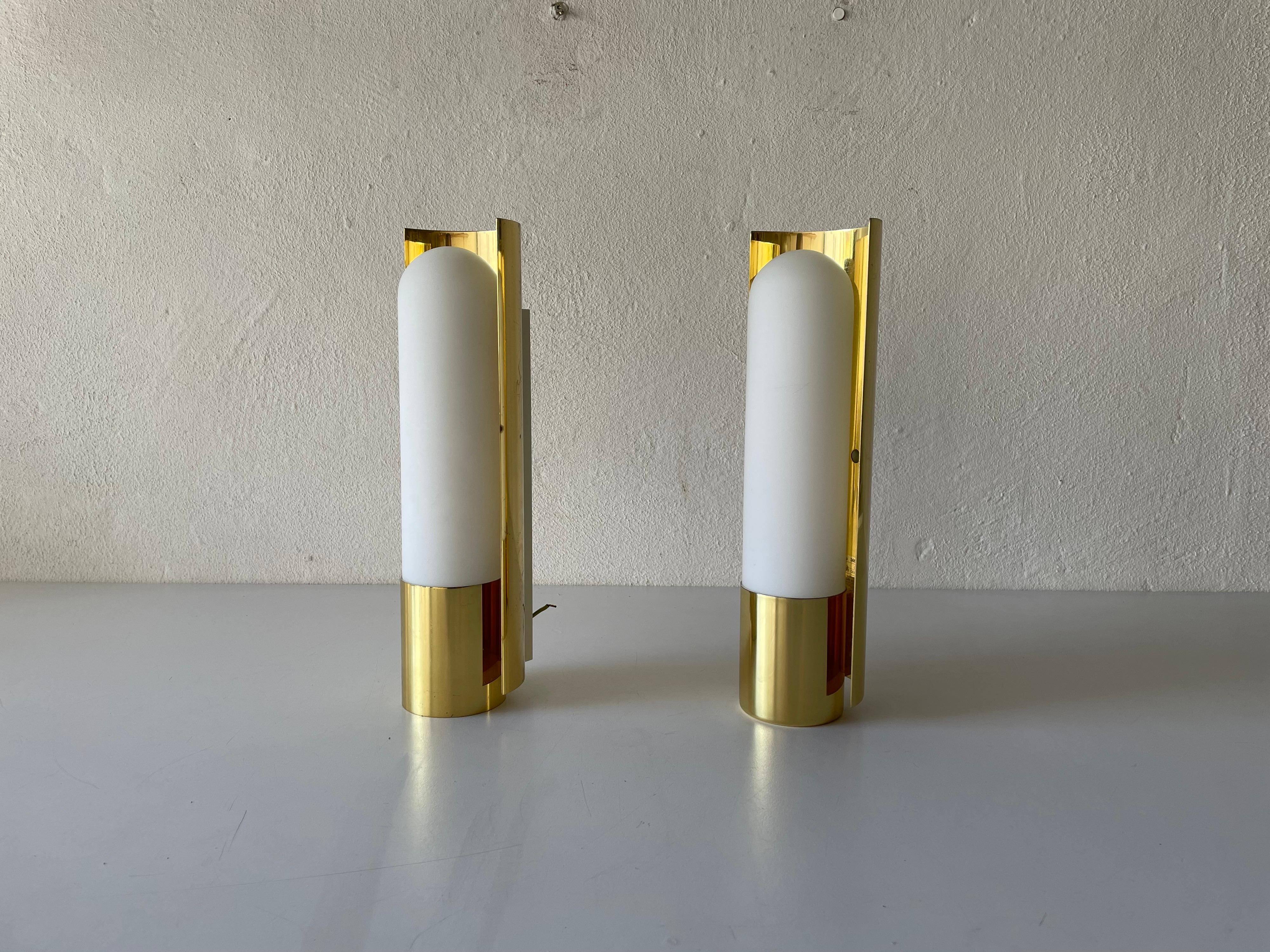 Opal Glass & Brass Pair of Sconces by Limburg, 1970s, Germany
Rare wall lights
Hollywood regency

Very elegant and Minimalist sconces

Lamps are in very good condition.

These lamps works with 11W Osram bulbs. 
Wired and suitable to use in