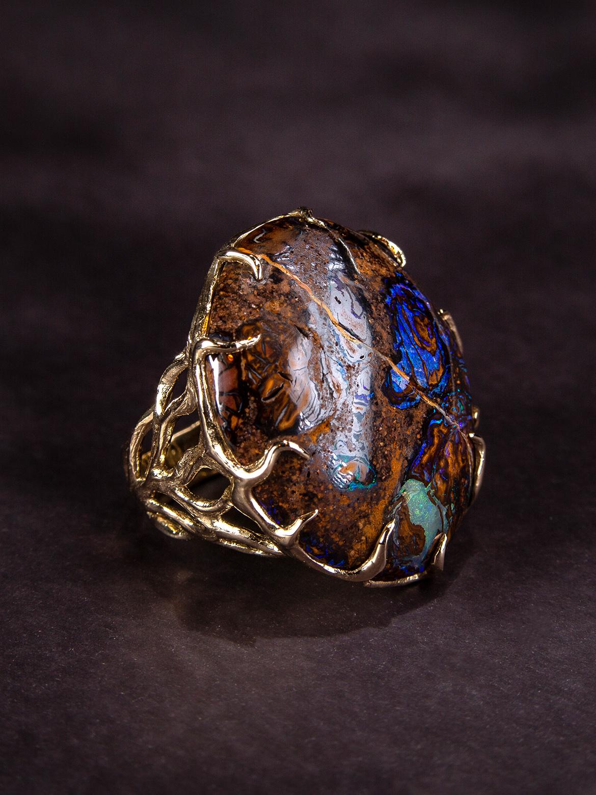 14K yellow gold ring with Boulder Koroit Opal
opal origin - Australia
opal measurements -  0.24 х 0.98 х 1.18 in / 6 х 25 х 30 mm
stone weight - 44.43 carats
ring weight - 16.9 grams
ring size - 7 US
Waves collection. We ship our jewelry worldwide –