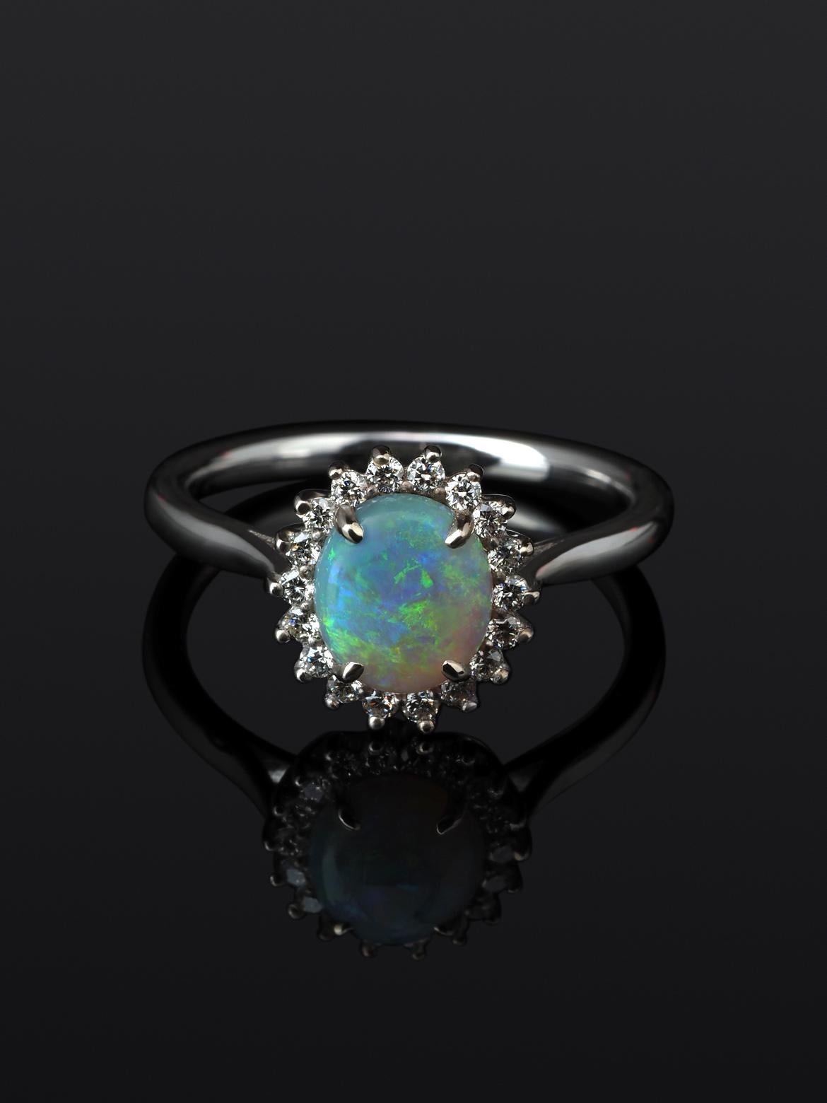 14K white gold ring with natural opal and diamonds
opal origin - Australia 
opal measurements - 0.079 х 0.28 х 0.31  in / 2 х 7 х 8 mm
stone weight - 0.81 carats
diamonds weight - 0.20 carats
ring size - 6.5 US (this ring may be resized, please
