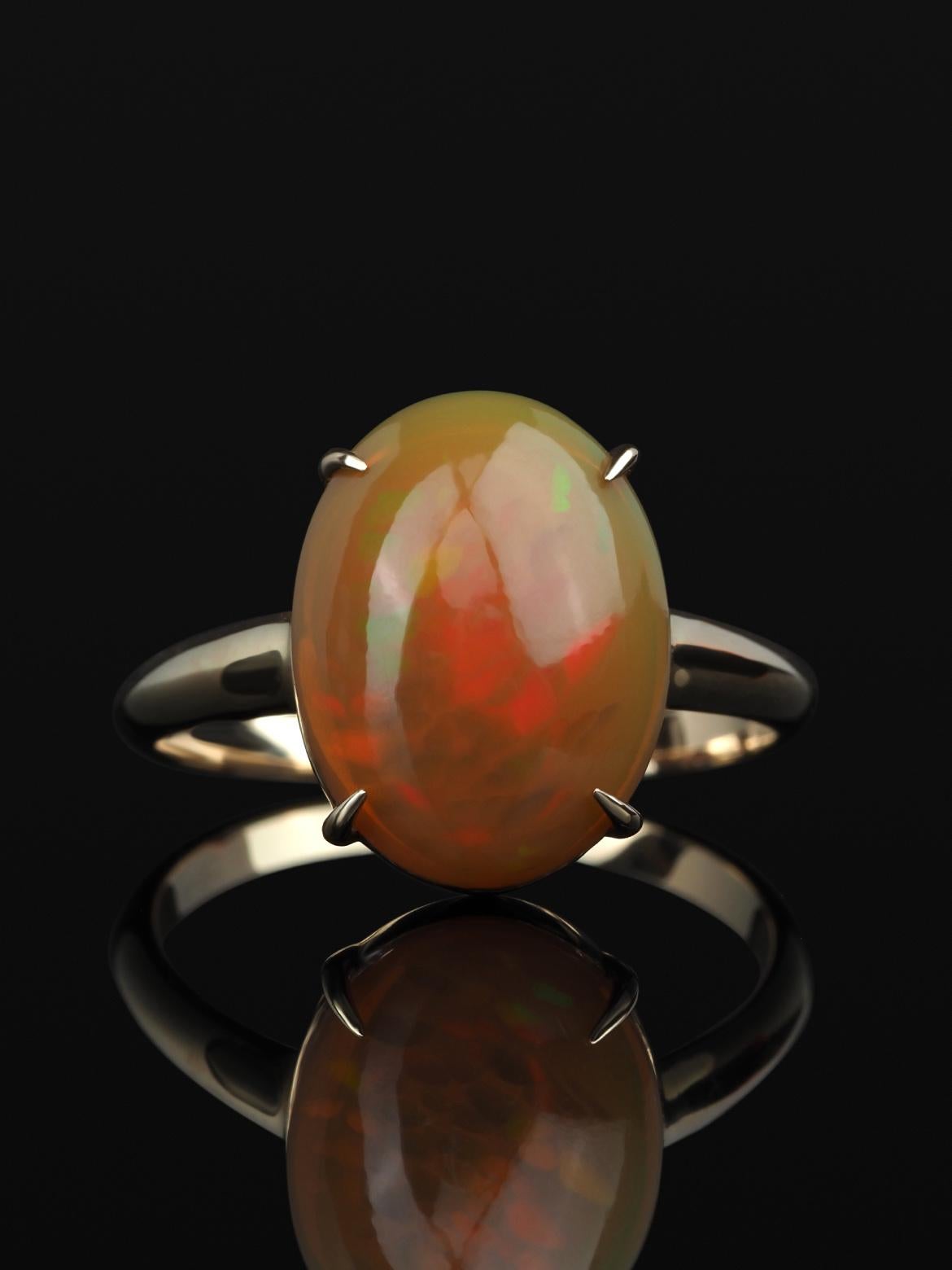 14K yellow gold ring with natural Opal
opal origin - Ethiopia 
opal measurements - 0.2 х 0.39 х 0.51 in / 5 х 10 х 13 mm
opal weight - 3.45 carats
ring size - 6.5 US (this ring may be resized, please contact us for further information) 
ring weight