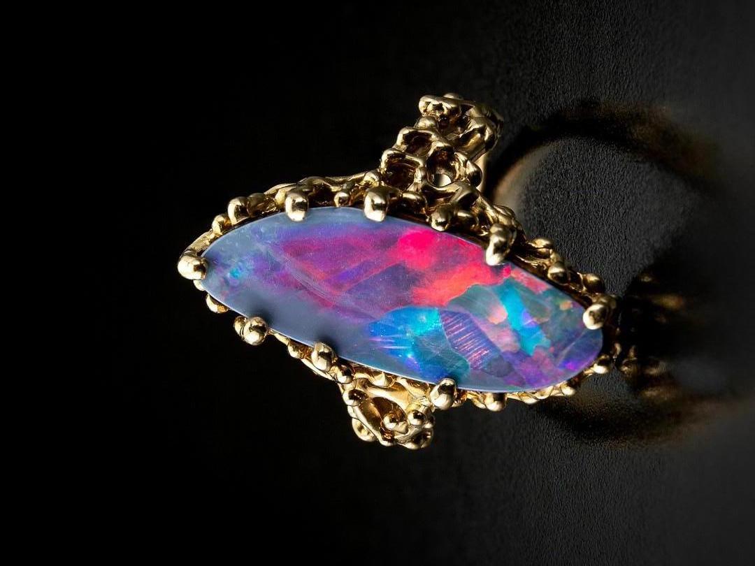 18K yellow gold ring with doublet of a natural black opal on a petrified wood base
opal origin - Australia 
opal measurements - 0.12 х 0.35 х 0.94 in / 3 х 9 х 24 mm
ring size - 7 US (this ring may be resized, please contact us for further