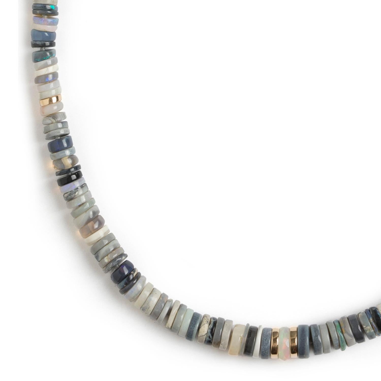 Featuring heishi opal beads that show opaque to translucent hues of tan, cream, blue & grey.

Opals: Australian heishi beads (AA grade)
7-5mm ~ the beads start out at 7mm in the center and taper to 5mm at the clasp. 
16'' length
Gold beads & clasp