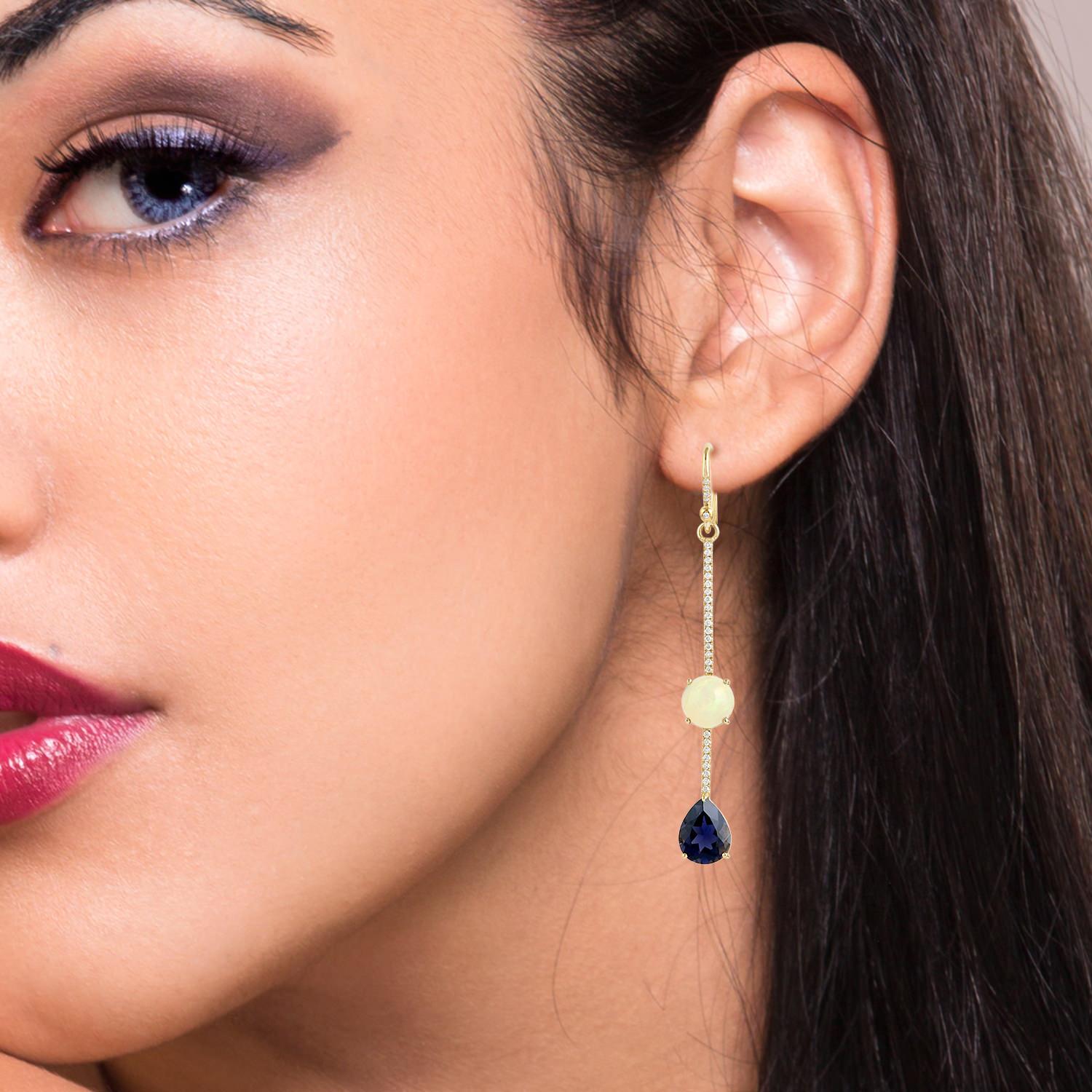 These beautiful linear drop earring are handcrafted in 18-karat gold. It is set with 3.53 carats Iolite, 4.17 carats Ethiopian opal and .36 carats of glimmering diamonds.

FOLLOW  MEGHNA JEWELS storefront to view the latest collection & exclusive