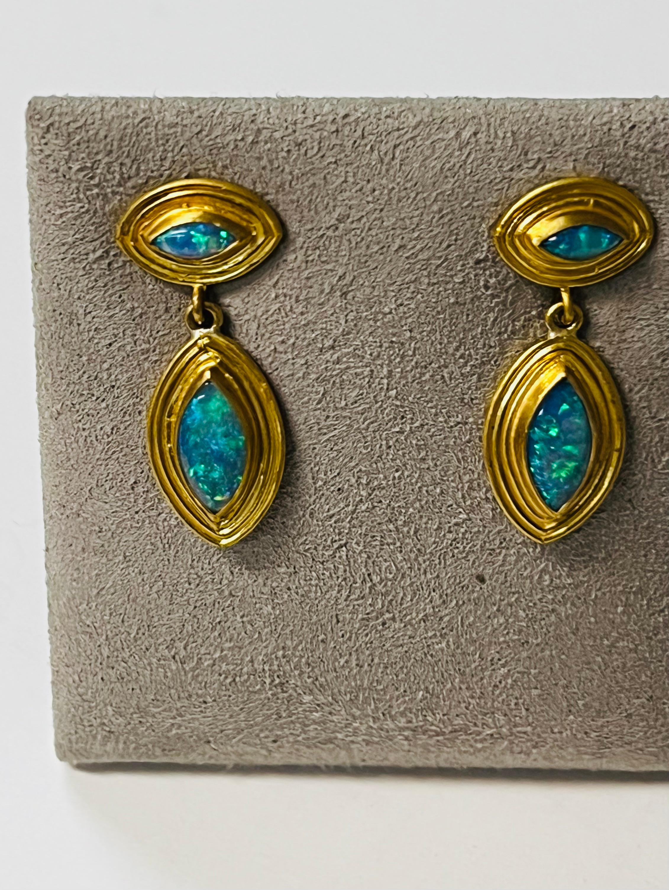 Fine Australian Opal Marquise earrings set in 22 Karat gold with 18 Karat posts and 14 Karat jumbo backs.
These beautiful earrings will light up anyone with their vivid yet delicate glow.
The opals weigh 2.42cts  and hang 1.82 inches long  .53