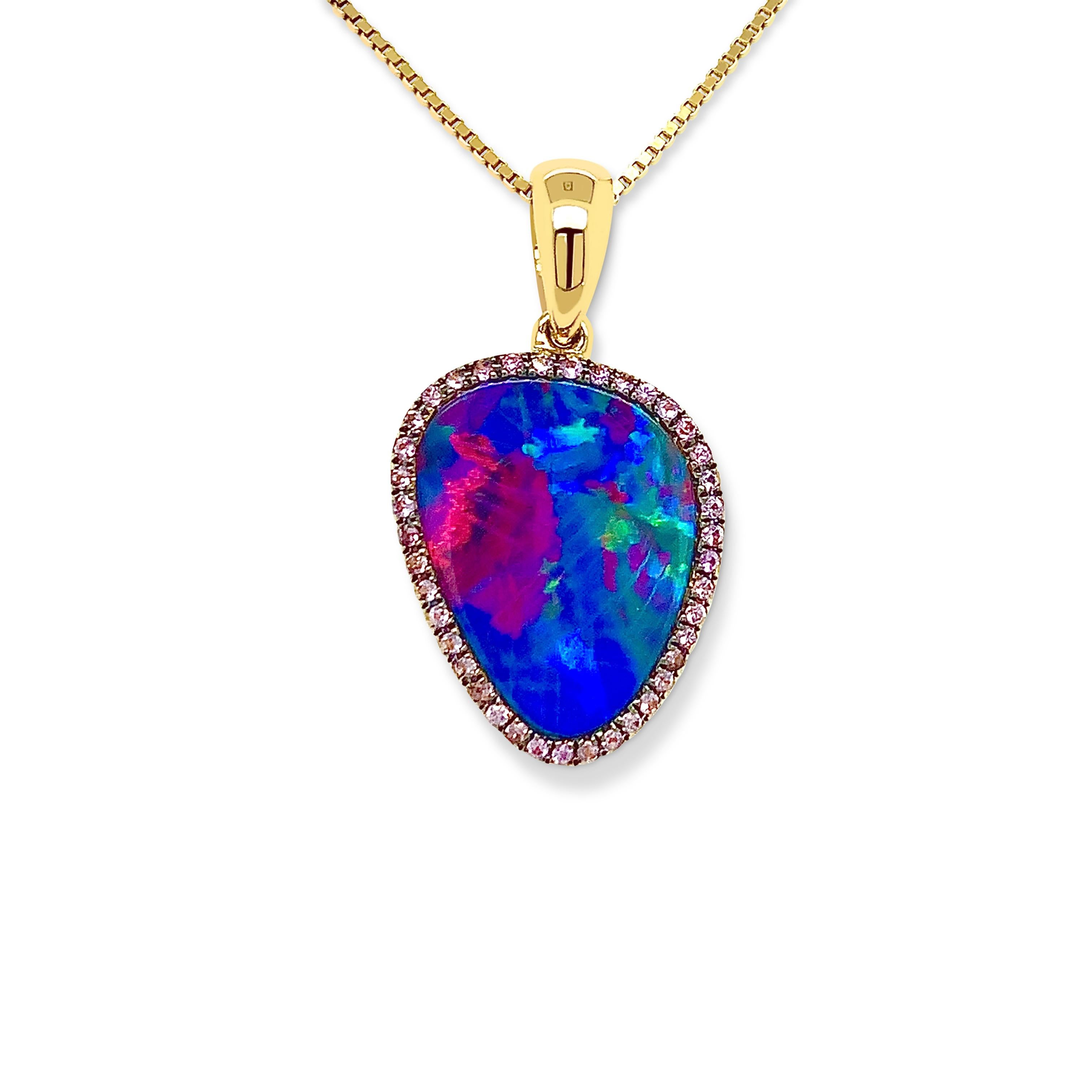 'Rose of My Heart' shows a premium quality Australian opal doublet (4.87ct) that features a unique red and blue play-of-colour, reminiscent of the rarest of opals. Crafted in 18K yellow gold with a rim of sparkling purple diamonds. This opal pendant