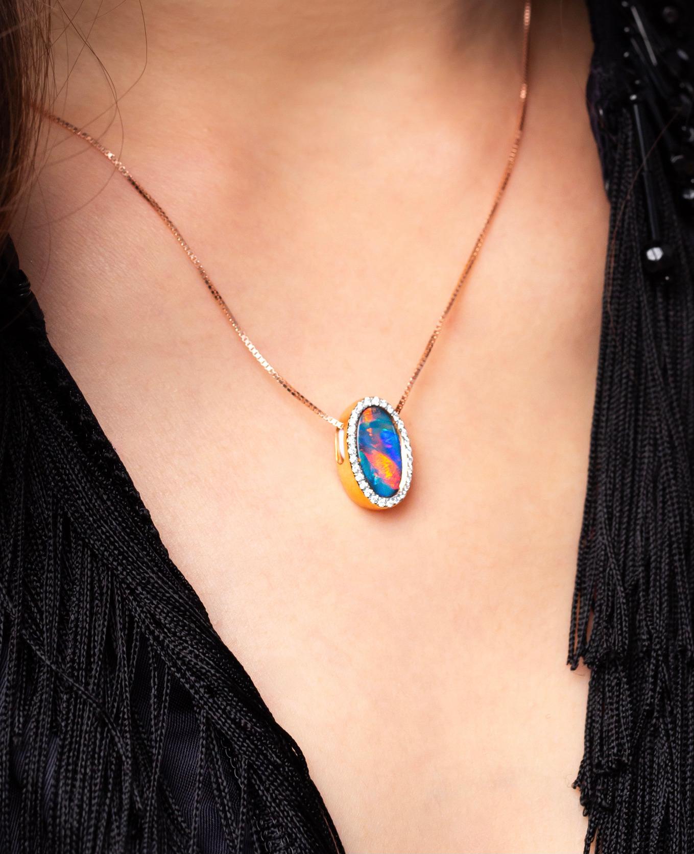 'Heaven’s Eye' is an elegant Australian opal pendant (1.83ct) framed by 29 diamonds and set in 18K rose gold. It’s the striking reds (the rarest and most valuable opal colour) that make this piece so desirable. Dress it up or dress it down. This