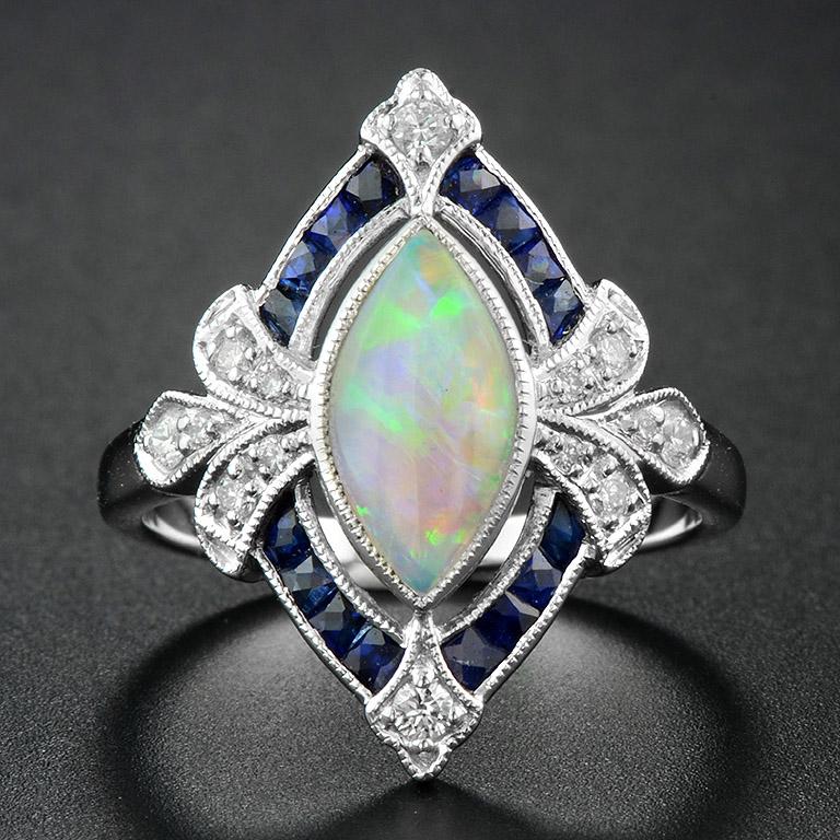 Opal Natural Blue Sapphire Diamond Ring
This Art Deco Style Ring was made in 18K White Gold. 
Flashing with Marquise Opal at the center, which has an iridescent color (blue, green, pink) 0.85 ct. and 14 pcs. of tiny Diamonds (0.17 ct.) add a little