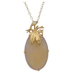 Collier pendentif en or jaune 14K avec opale ovale et diamant blanc