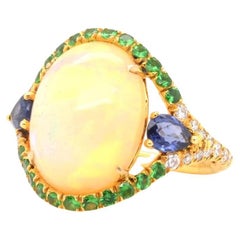 Vintage Opal, pear sapphires, fine stones and brilliant cut diamonds ring