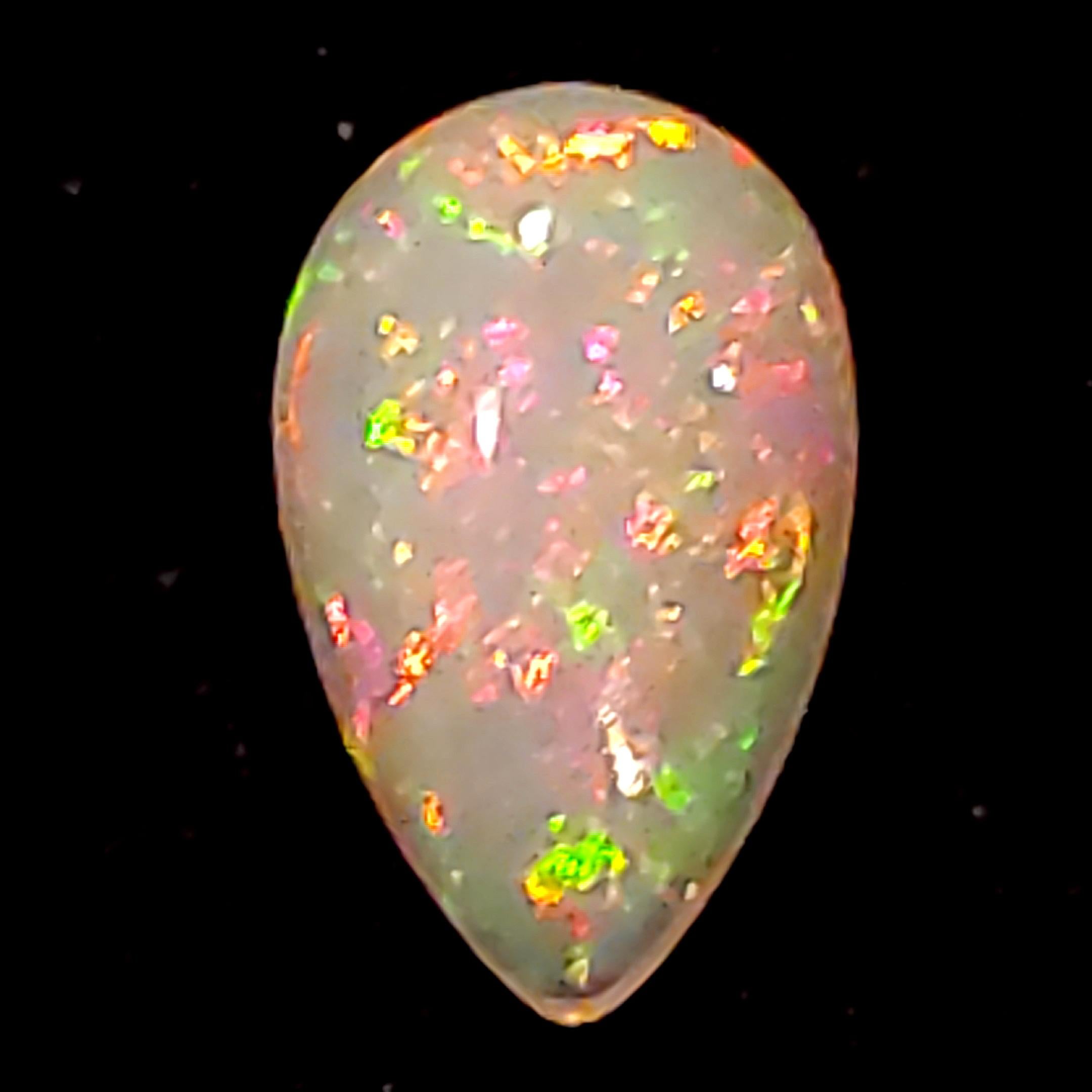 A very beautiful Opal with lots of Life and Play of Color as can be seen in the photos and the video.  Weighs approx 6.80ct - the actual weight will vary a bit depending on whether it has been exposed to water as it is hydrophillic (water loving)