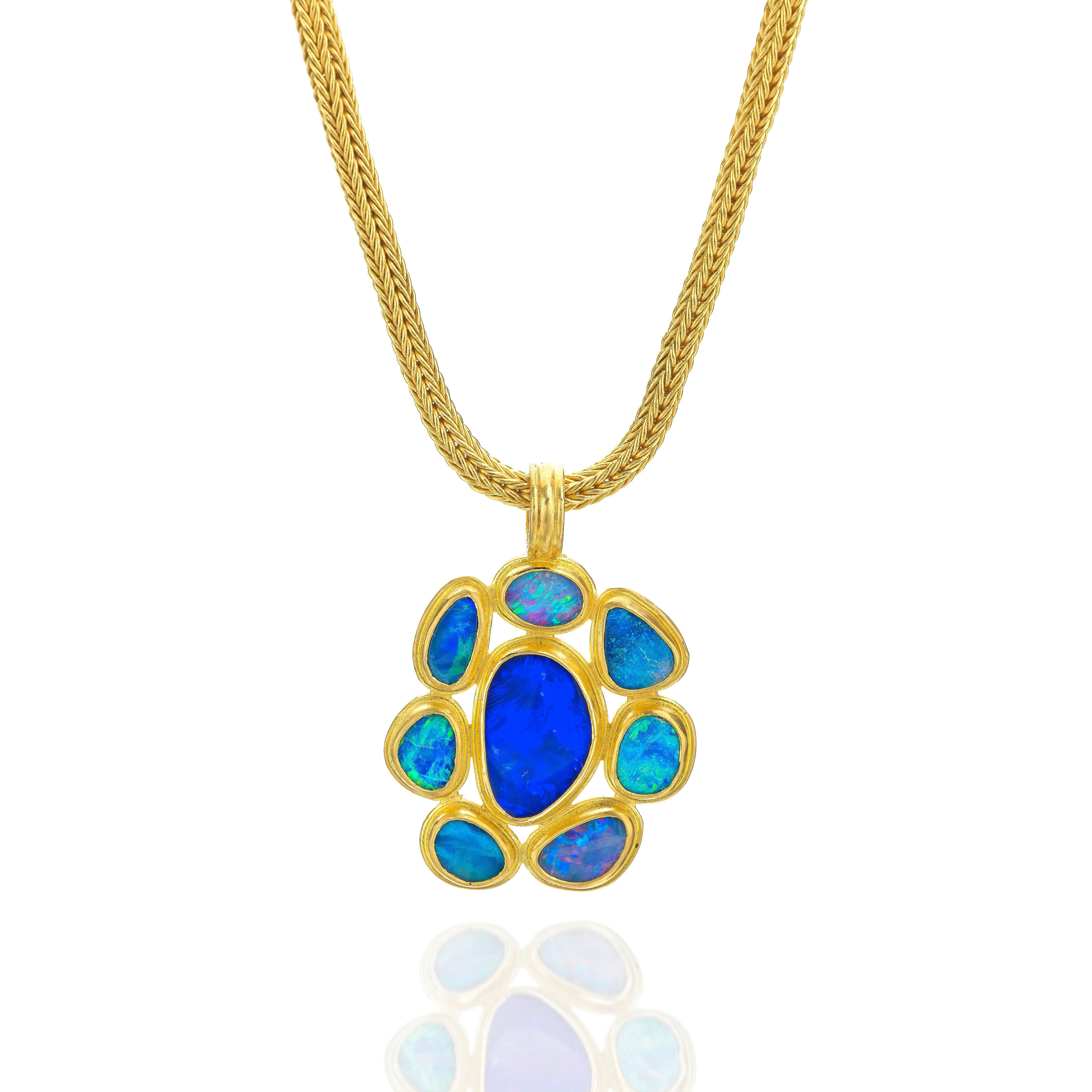 
In Roman times around 250BC opals were valued above all other gems.
Dramatic and vibrant, this free form Opal pendant is set in 22Karat gold and entirely hand crafted by the artist in NYC.
It is presented on a roman rope chain which can be