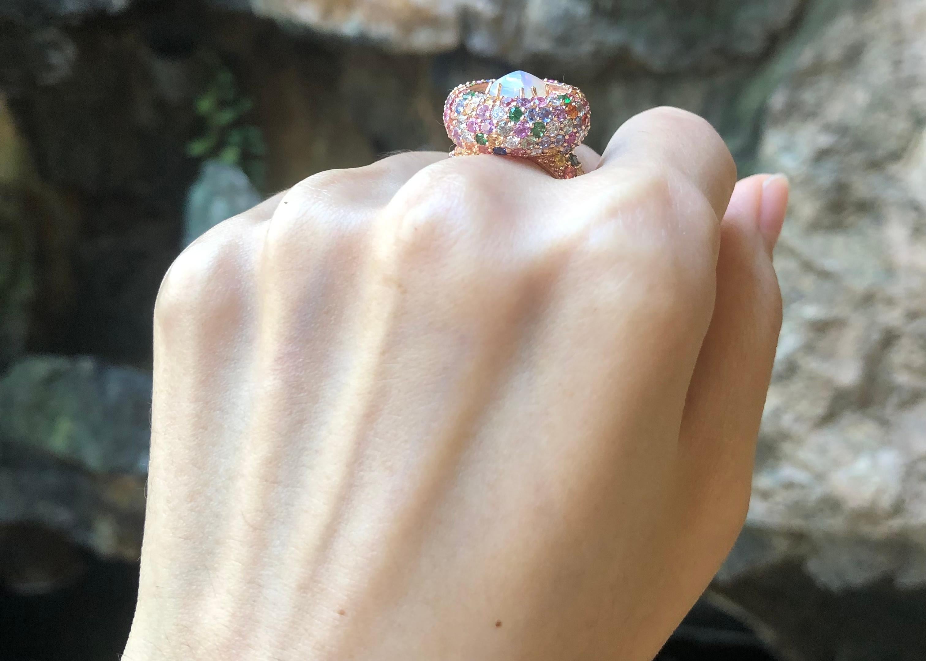 Opal 1.35 carats, Rainbow Colour Sapphire 5.88 carats and Diamond 0.58 carat Ring set in 18K Rose Gold Settings

Width:  2.0 cm 
Length: 2.0 cm
Ring Size: 54
Total Weight: 12.95 grams

