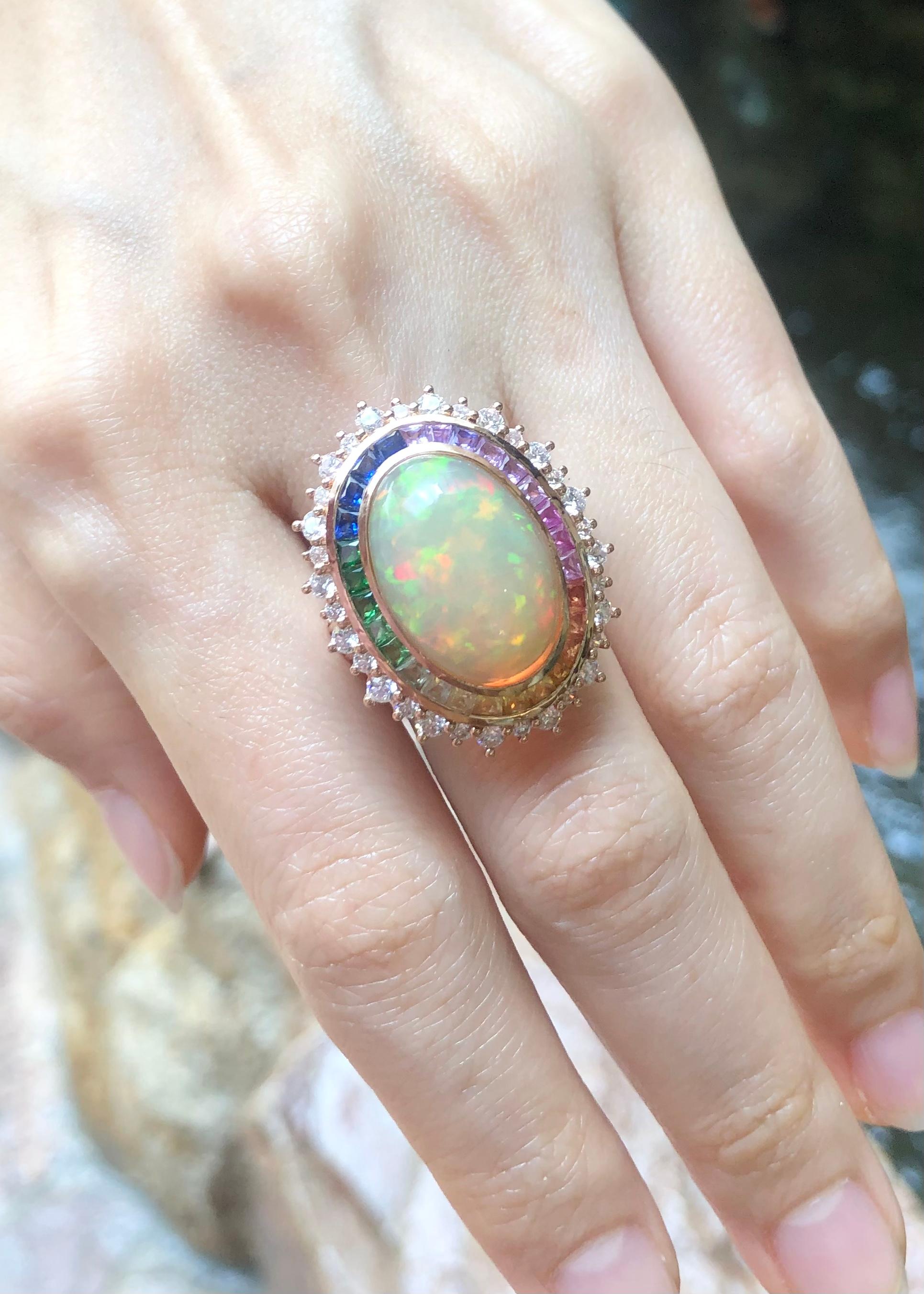 Opal 6.72 carats, Rainbow Coloured Sapphire 2.36 carats and Diamond 1.56 carats Ring set in 18K Rose Gold Settings

Width:  2.1 cm 
Length: 3.8 cm
Ring Size: 53
Total Weight: 12.44 grams

