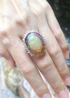 Anello con opale, zaffiro colorato e diamante incastonato in oro rosa 18 carati