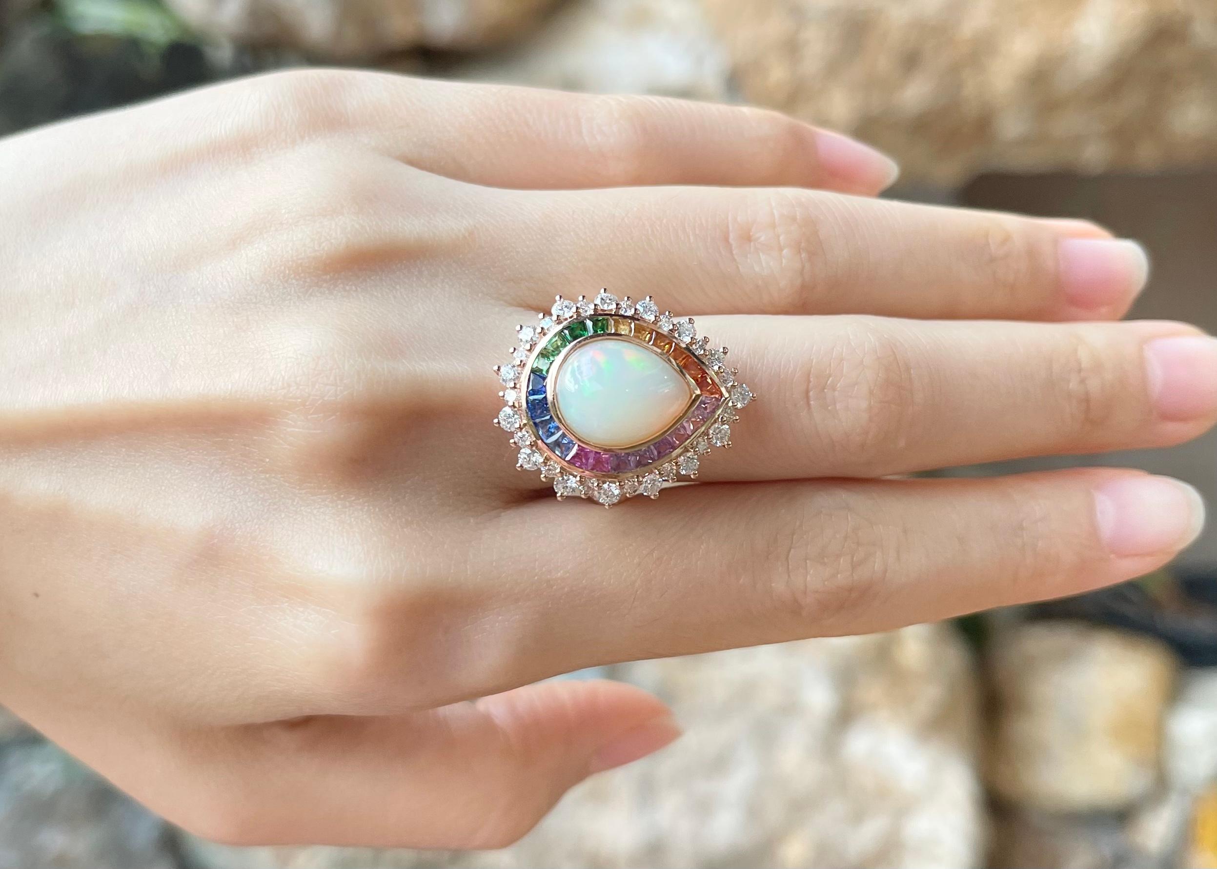 Opal 4.15 carats, Rainbow Coloured Sapphire 2.80 carats and Diamond 1.33 carats Ring set in 18K Rose Gold Settings

Width:  2.0 cm 
Length: 2.5 cm
Ring Size: 52
Total Weight: 10.44 grams

