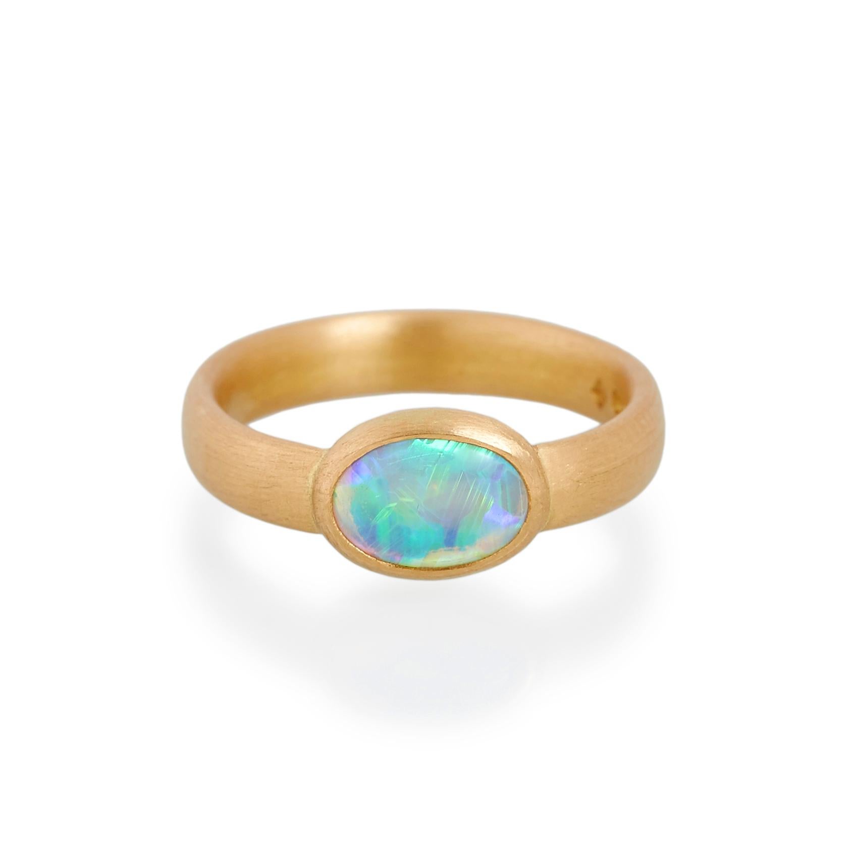 Cabochon opal ring.
Ref: G15007

9mm x 6mm natural opal  
22ct gold

Cadby & Co are a family business that specialise in reusing & up cycling old cut diamonds and fine gem stones. Deborah Cadby’s designs and skills in making are combined with Jeff