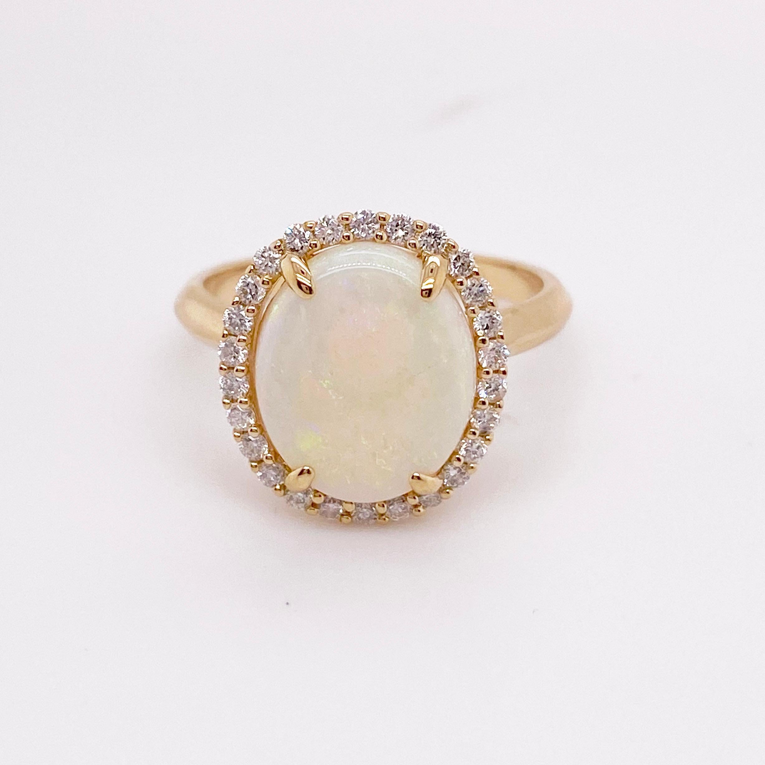For Sale:  Opal Ring with a Diamond Halo Set 2.82 carats total weight gemstones Yellow Gold 2