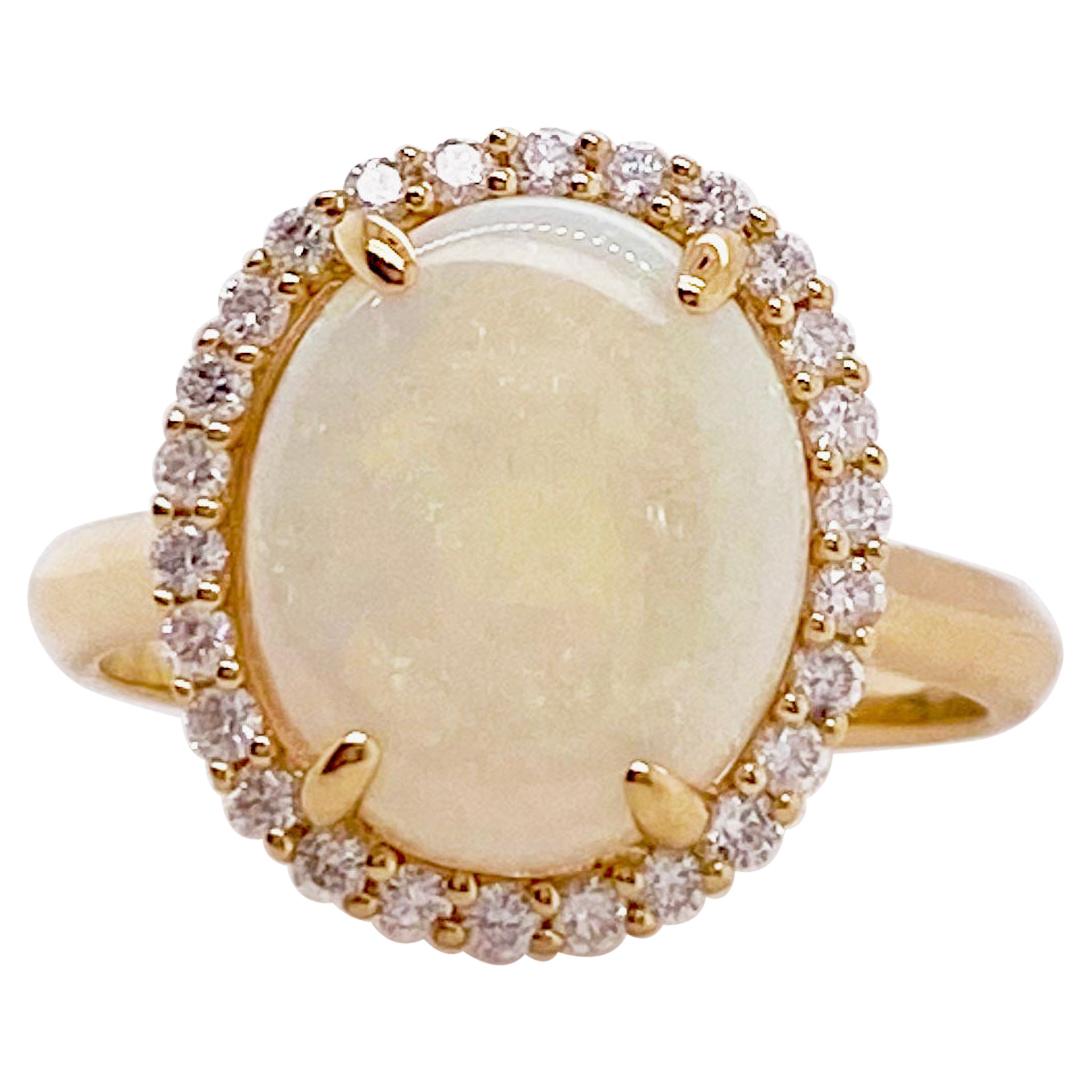 Opal Ring with a Diamond Halo Set 2.82 carats total weight gemstones Yellow Gold