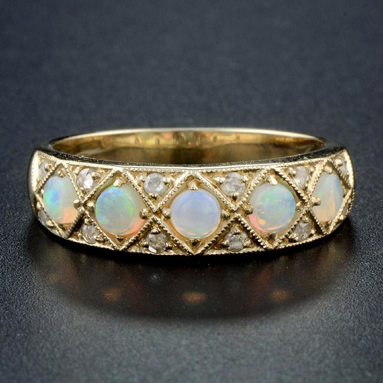 A superb quality antique Classic Victorian 18K gold and graduated opal five stone ring, each oval cabochon opal is set in four prongs yellow gold mount. The opals are well matched and each shows magnificent play-of-color with flashes of greens,